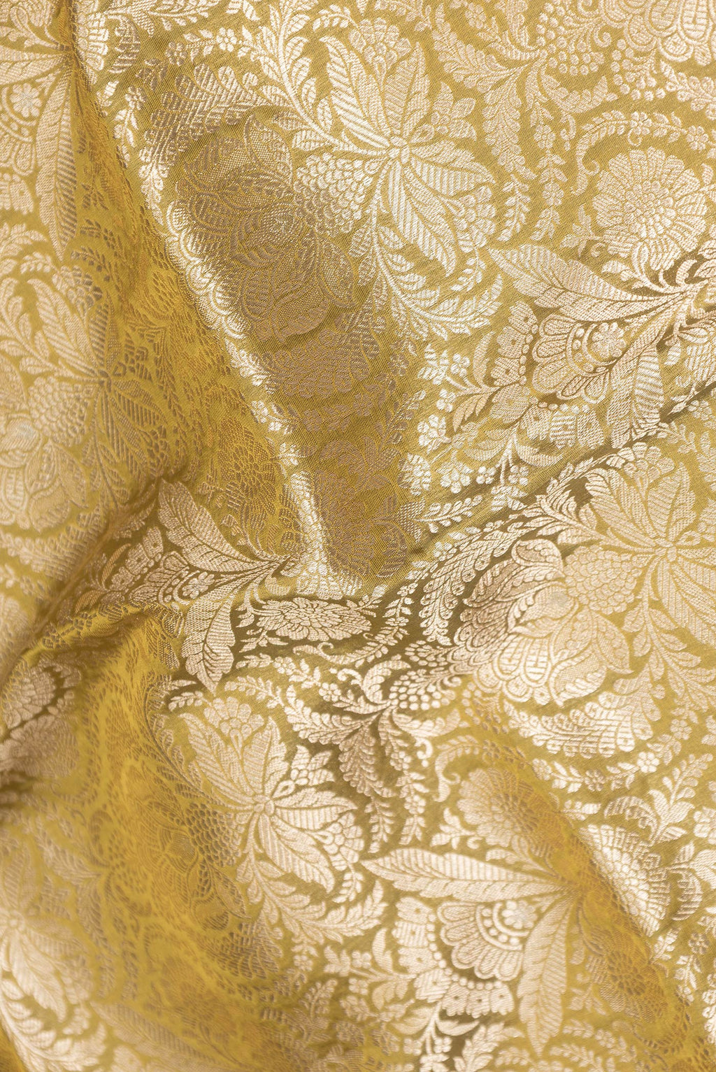 Close up of Mehandi Green Dual Tone Banarasi Silk Saree with Zari Brocade on the body and Zari Border.  displaying folds