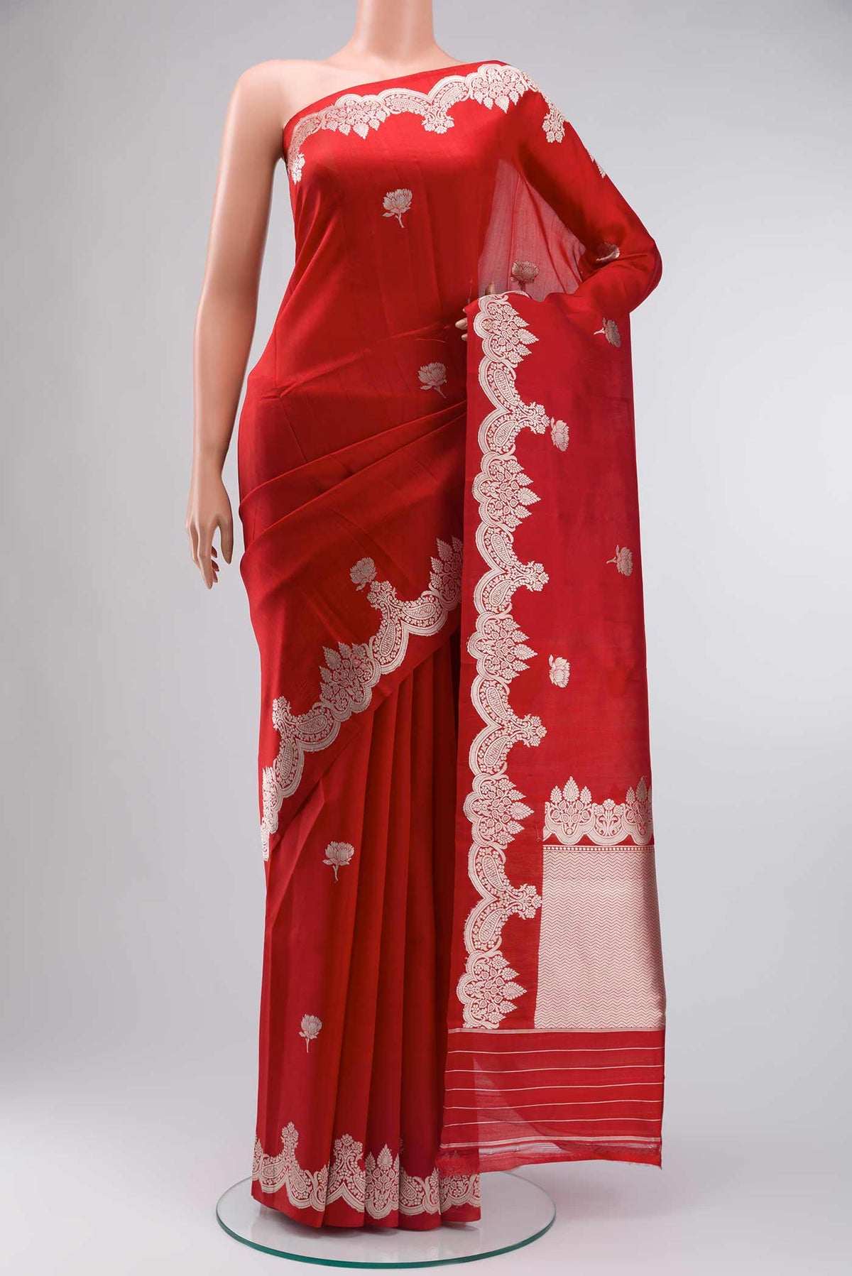 Red Banarasi Silk Saree with Zari Butta on the body and Zari Border displayed on a mannequin