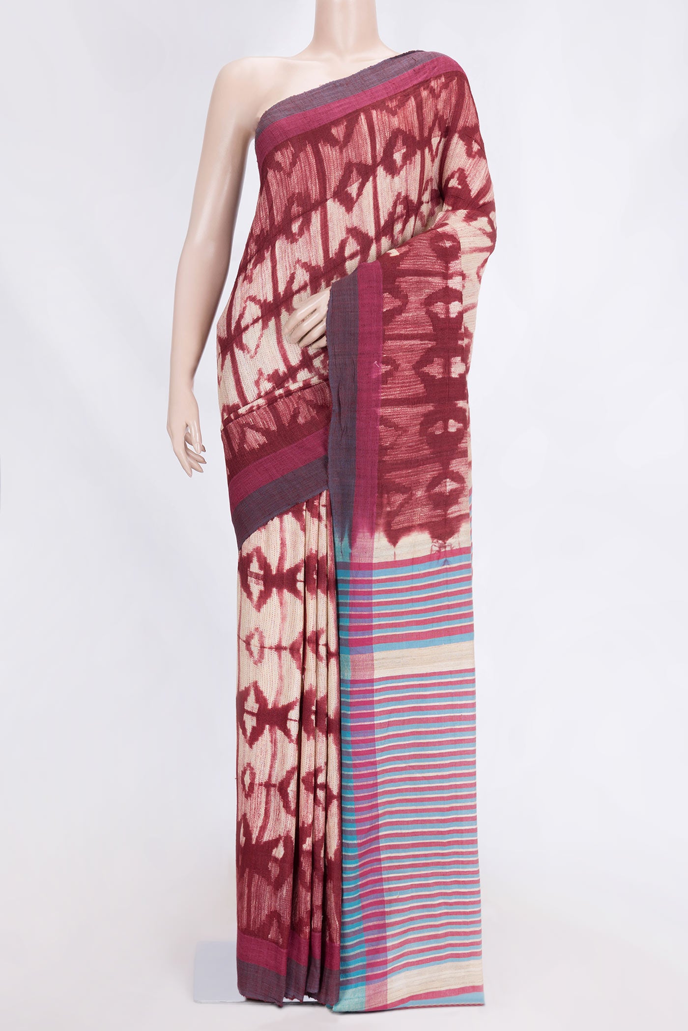 Beige Dual Tone Tussar Saree with Printed design on the body and Plain Border.  displayed on a mannequin