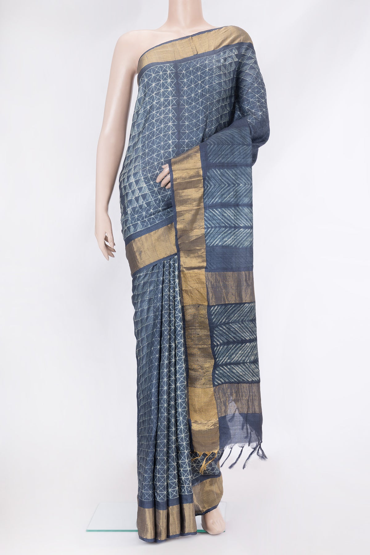 Navy Blue Dual Tone Tussar Silk Saree with Printed design on the body and Zari Border.  displayed on a mannequin