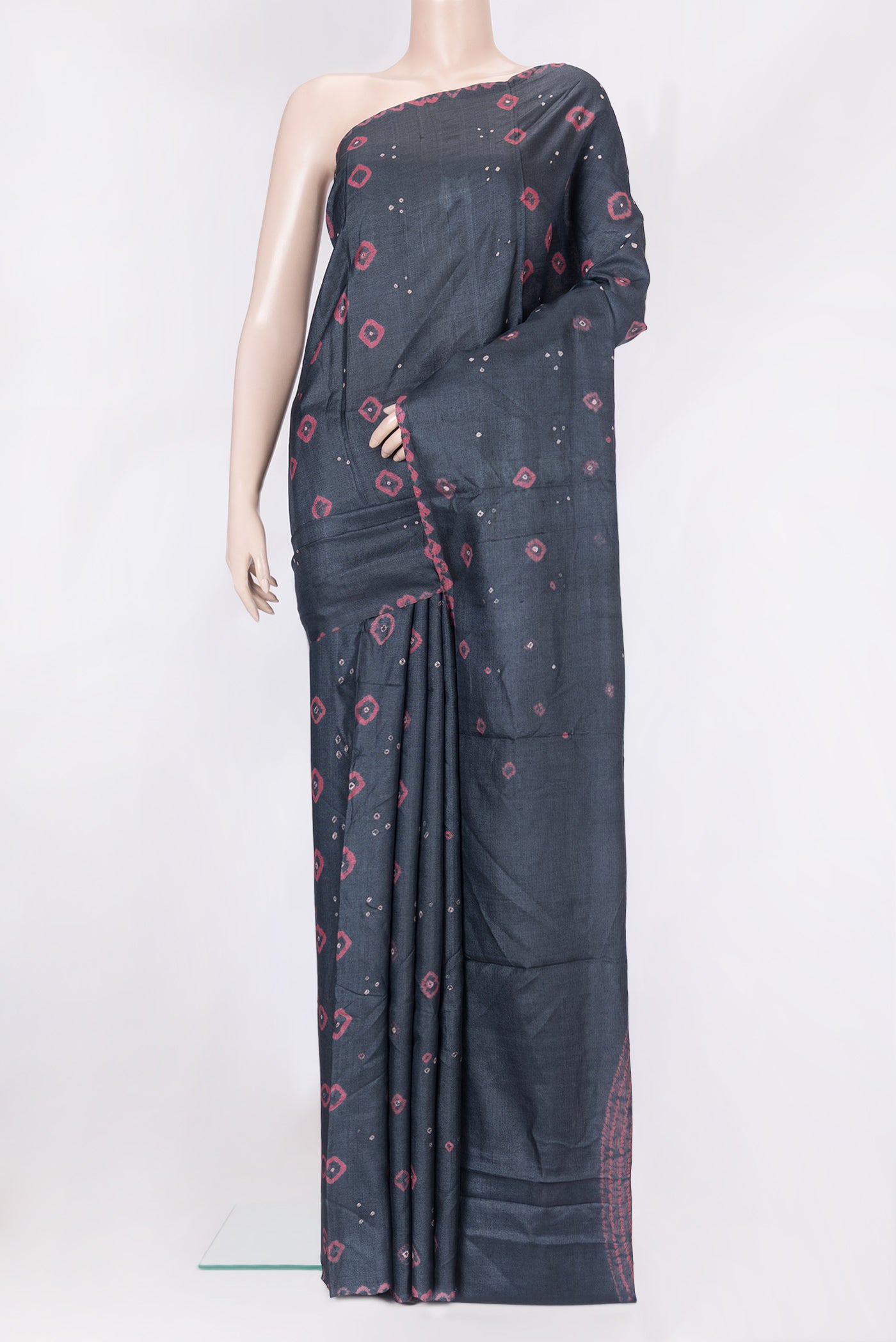 Black Tussar Silk Saree with Bandhani Print on the body and Printed Border.  displayed on a mannequin