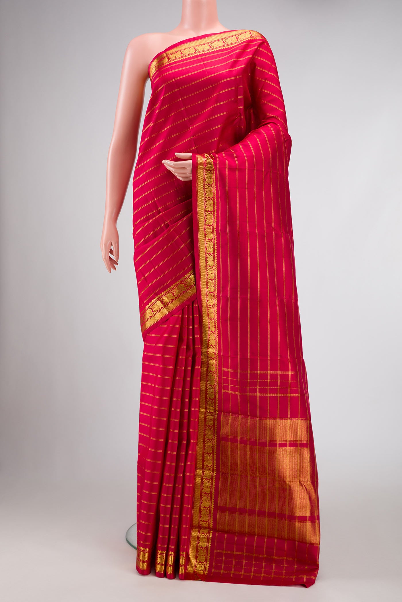 Maroon Dual Tone Kanchipuram Silk Saree with Stripes on the body and Zari Border displayed on a mannequin