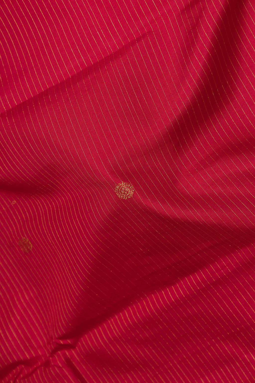 Close up of Maroon Dual Tone Kanchipuram Silk Saree with Stripes on the body and Zari Border displaying folds