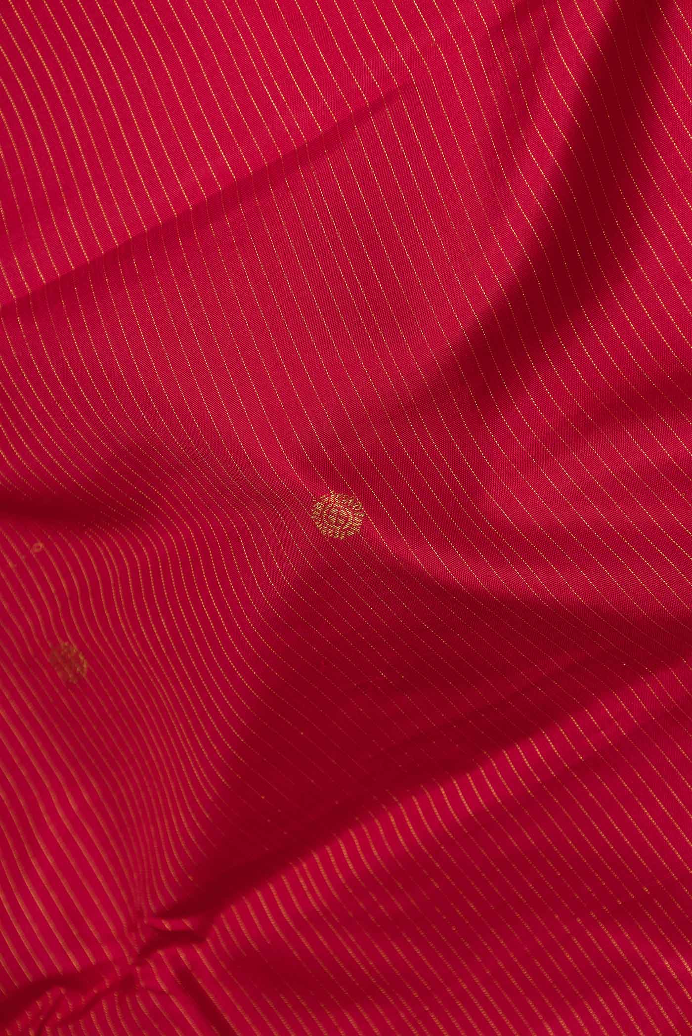 Close up of Maroon Dual Tone Kanchipuram Silk Saree with Stripes on the body and Zari Border displaying folds