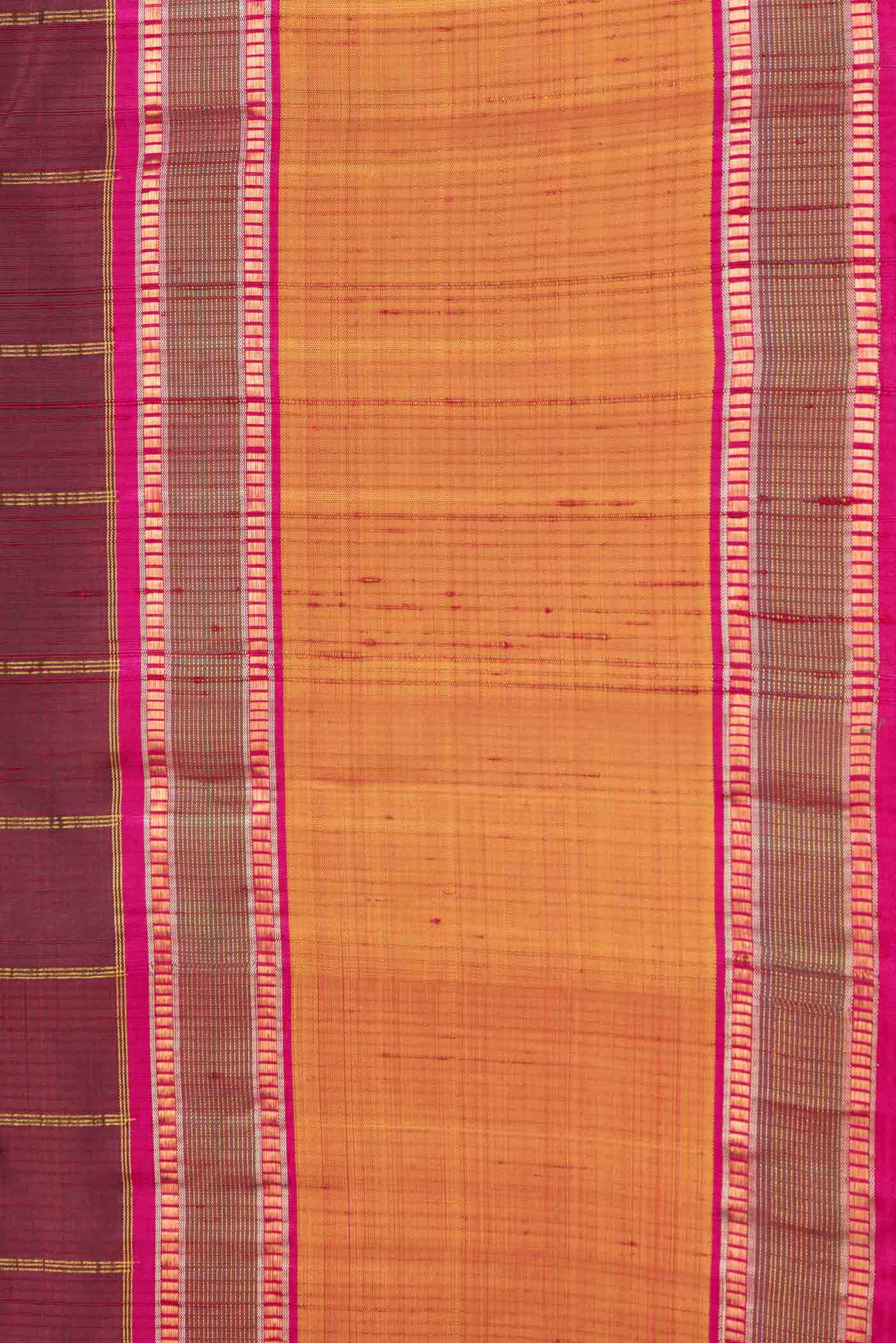 Border image of Maroon Dual Tone Kanchipuram Silk Saree with Checked design on the body and Zari Border. 