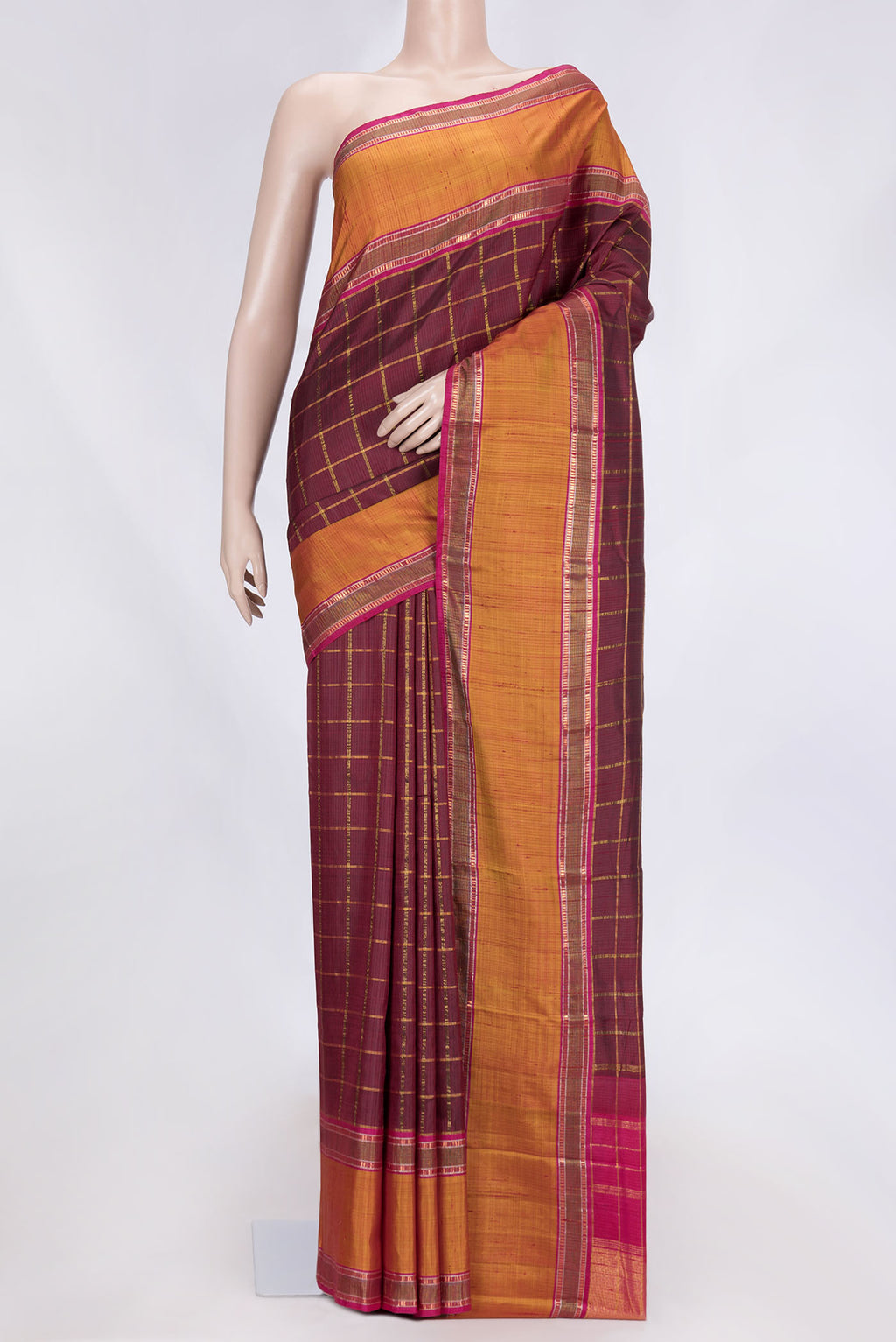 Maroon Dual Tone Kanchipuram Silk Saree with Checked design on the body and Zari Border.  displayed on a mannequin