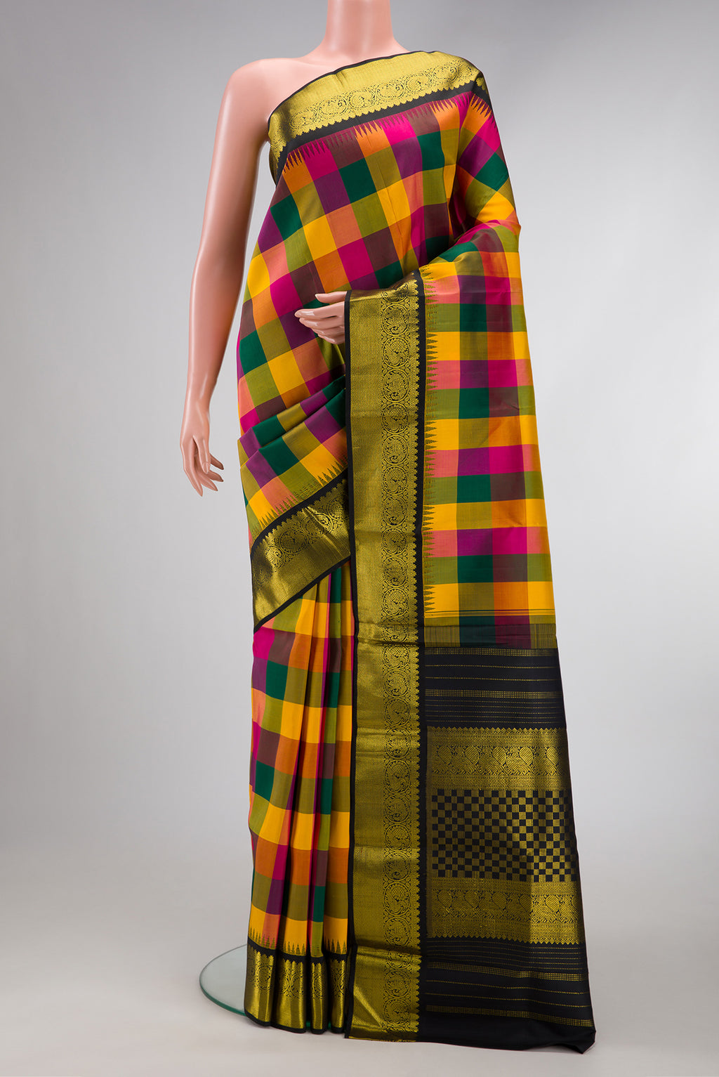 Multi Color Kanjivaram Silk Saree with Checked design on the body and Zari Border.  displayed on a mannequin