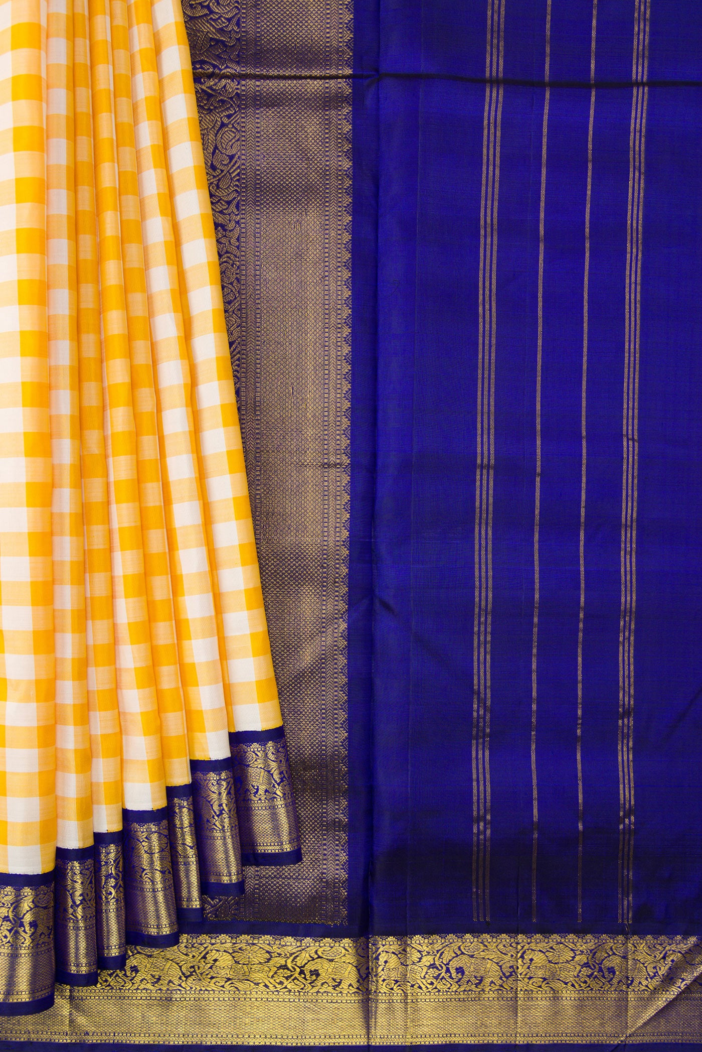 Pleats and pallu of Pure Silk Pure Zari Off White and Musturd Color Kanchipuram Nine Yards Saree with Checked design on the body and Zari Border. 