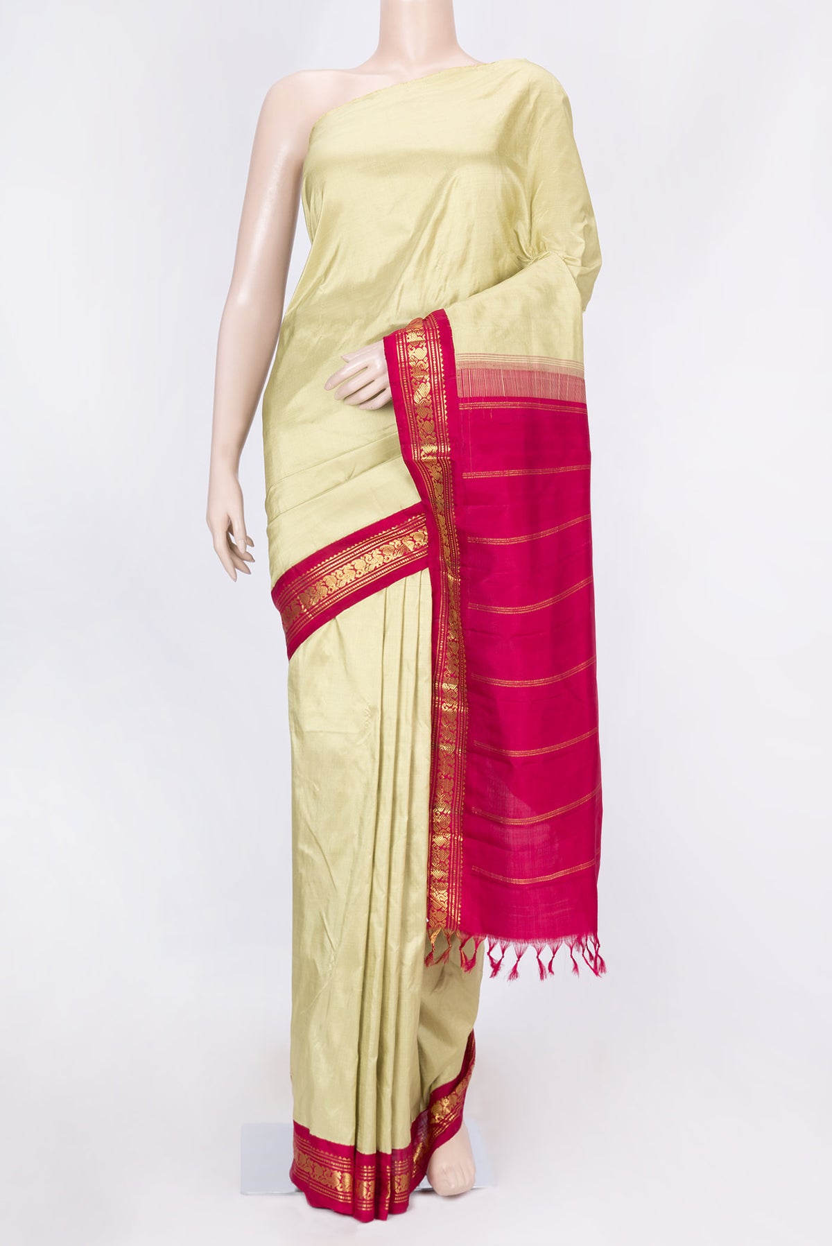 Pure Silk Pure Zari Beige Kanchipuram Saree with Plain Body and One Side Border displayed on a mannequin