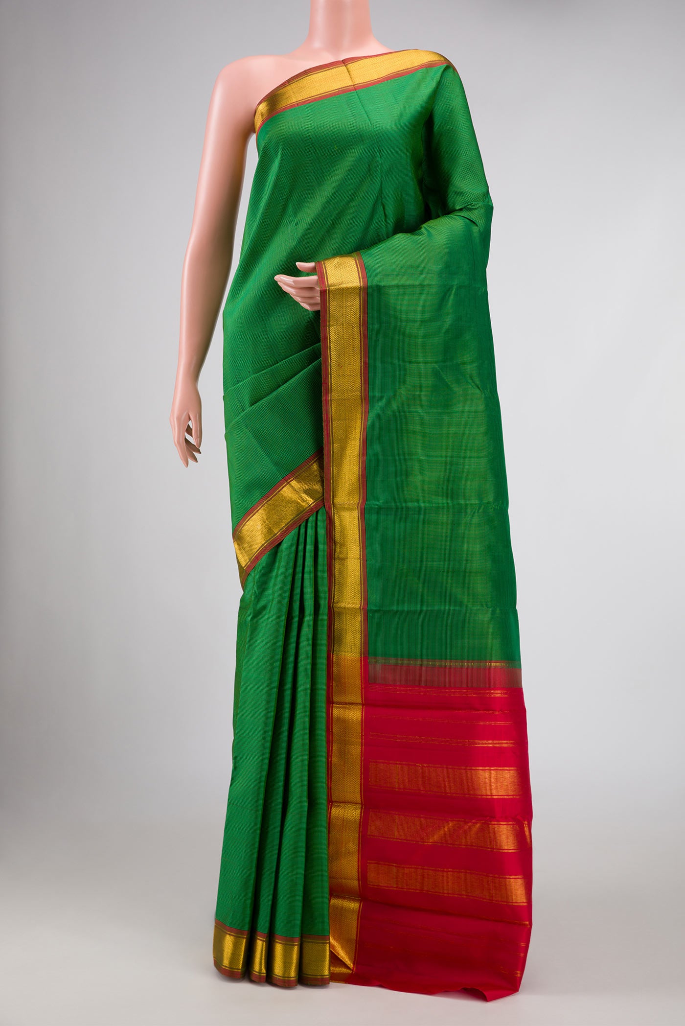 Green Dual Tone Kanchipuram Silk Saree with Checked design on the body and Zari Border displayed on a mannequin