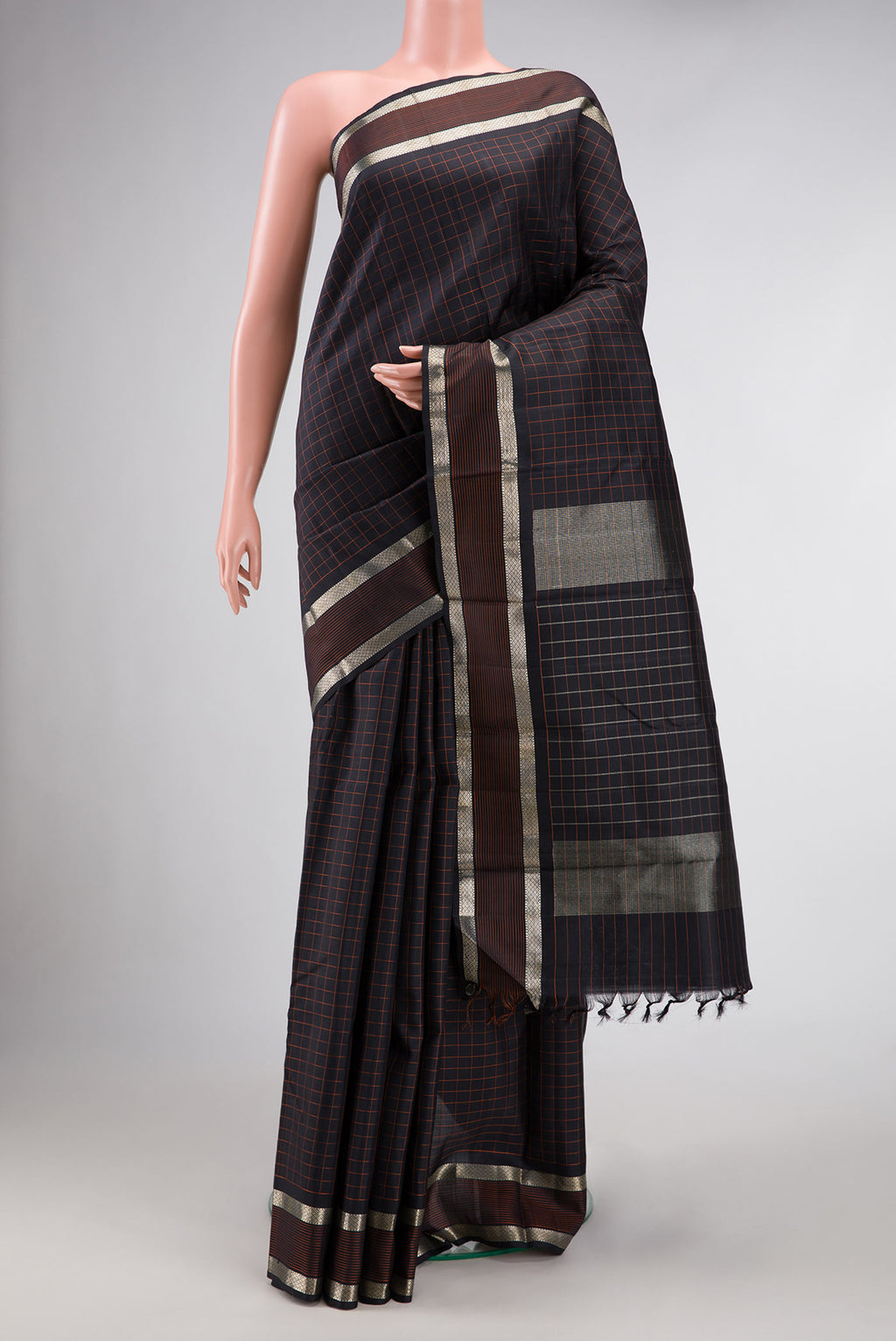 Black Dual Tone Kanjivaram Silk Saree with Checked design on the body and Zari Border.  displayed on a mannequin