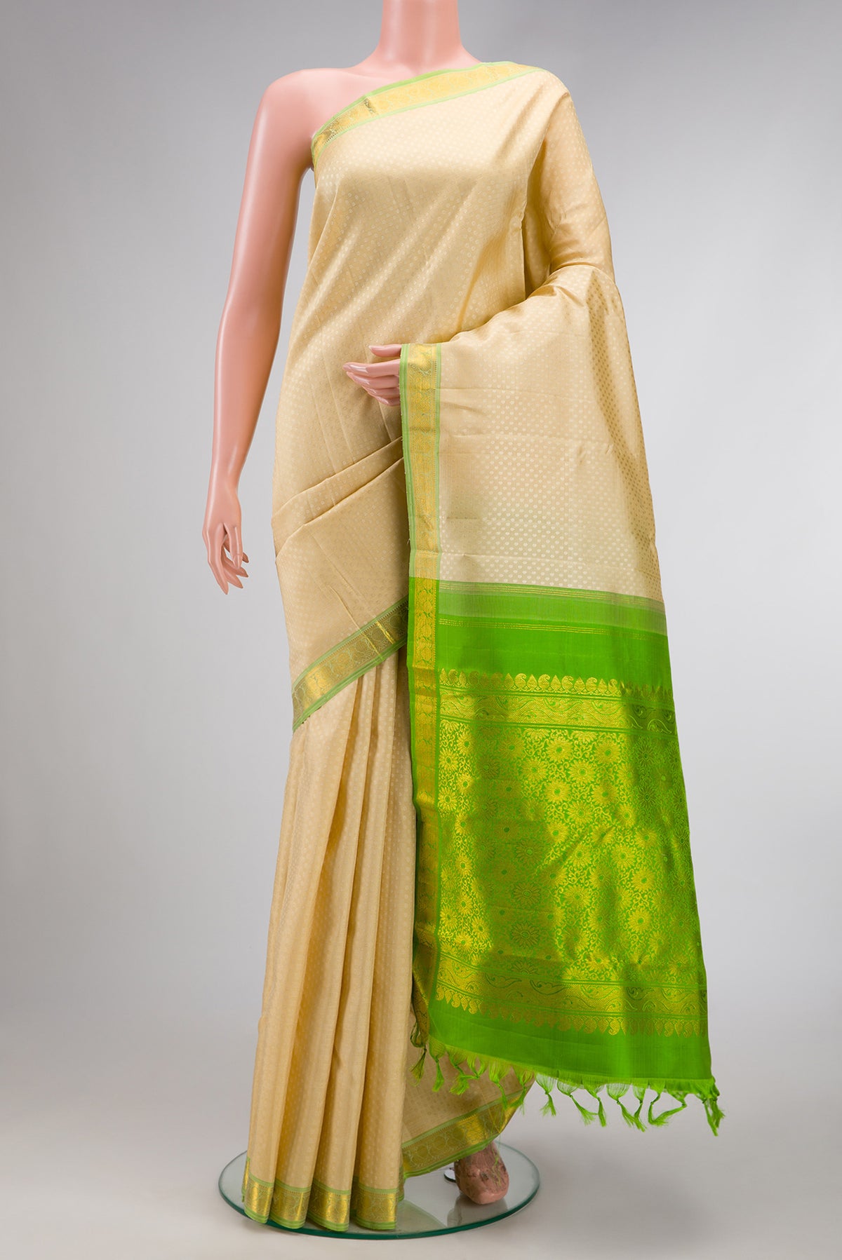 Sandal Dual Tone Kanchipuram Silk Saree with Jacquard design on the body and Zari Border.  displayed on a mannequin