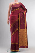 Pink Kanchipuram Silk Saree with Zari Butta on the body and Zari Border displayed on a mannequin