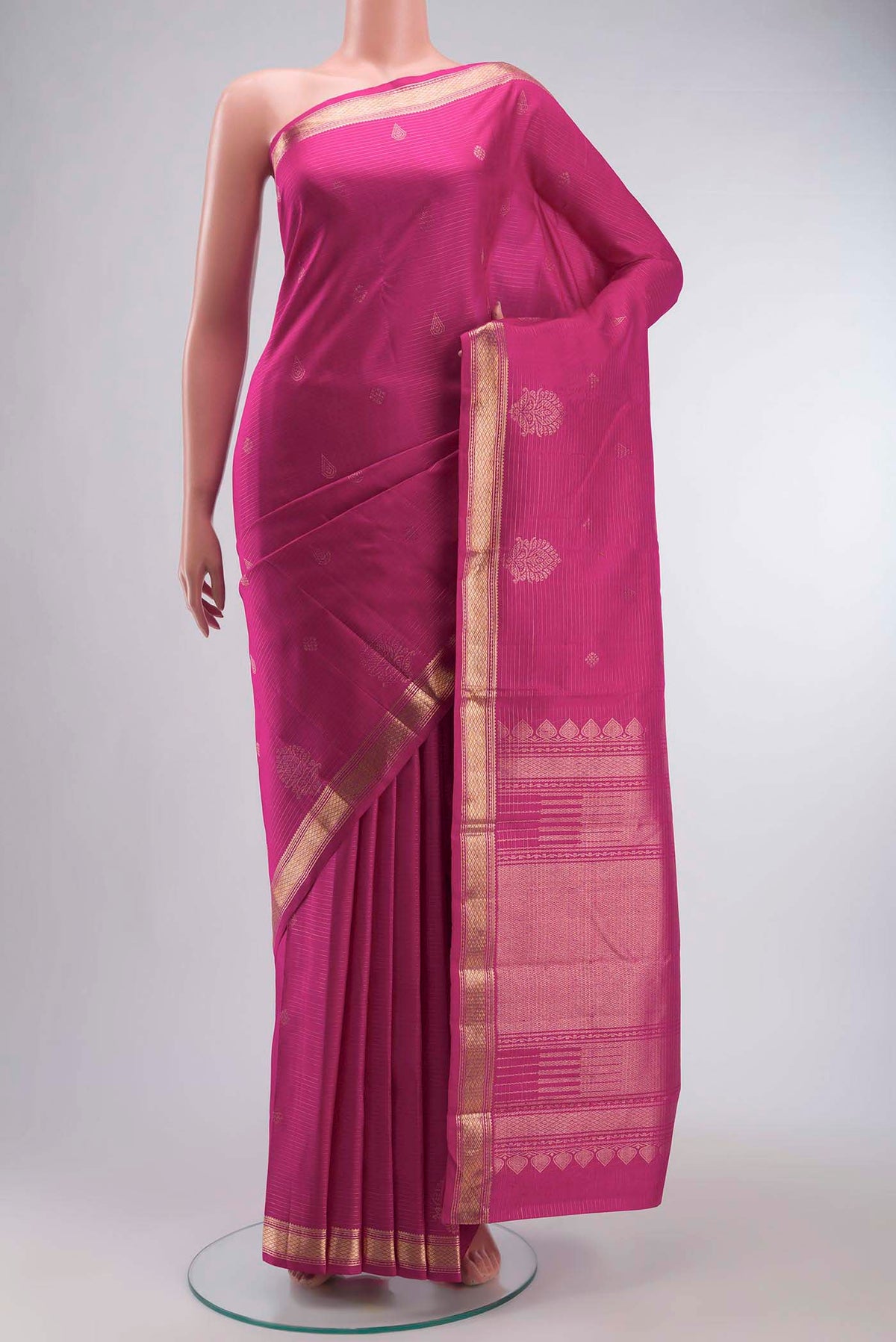 Pink Kanchipuram Silk Saree with Zari Butta on the body and Zari Border displayed on a mannequin