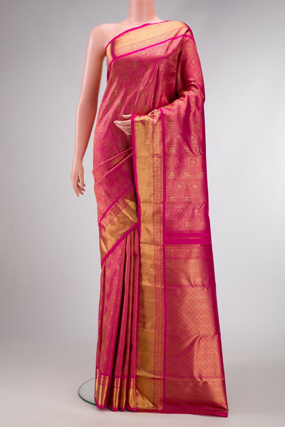 Pure Silk Pure Zari Pink Dual Tone Kanjivaram Saree with Zari Brocade on the body and Zari Border.  displayed on a mannequin