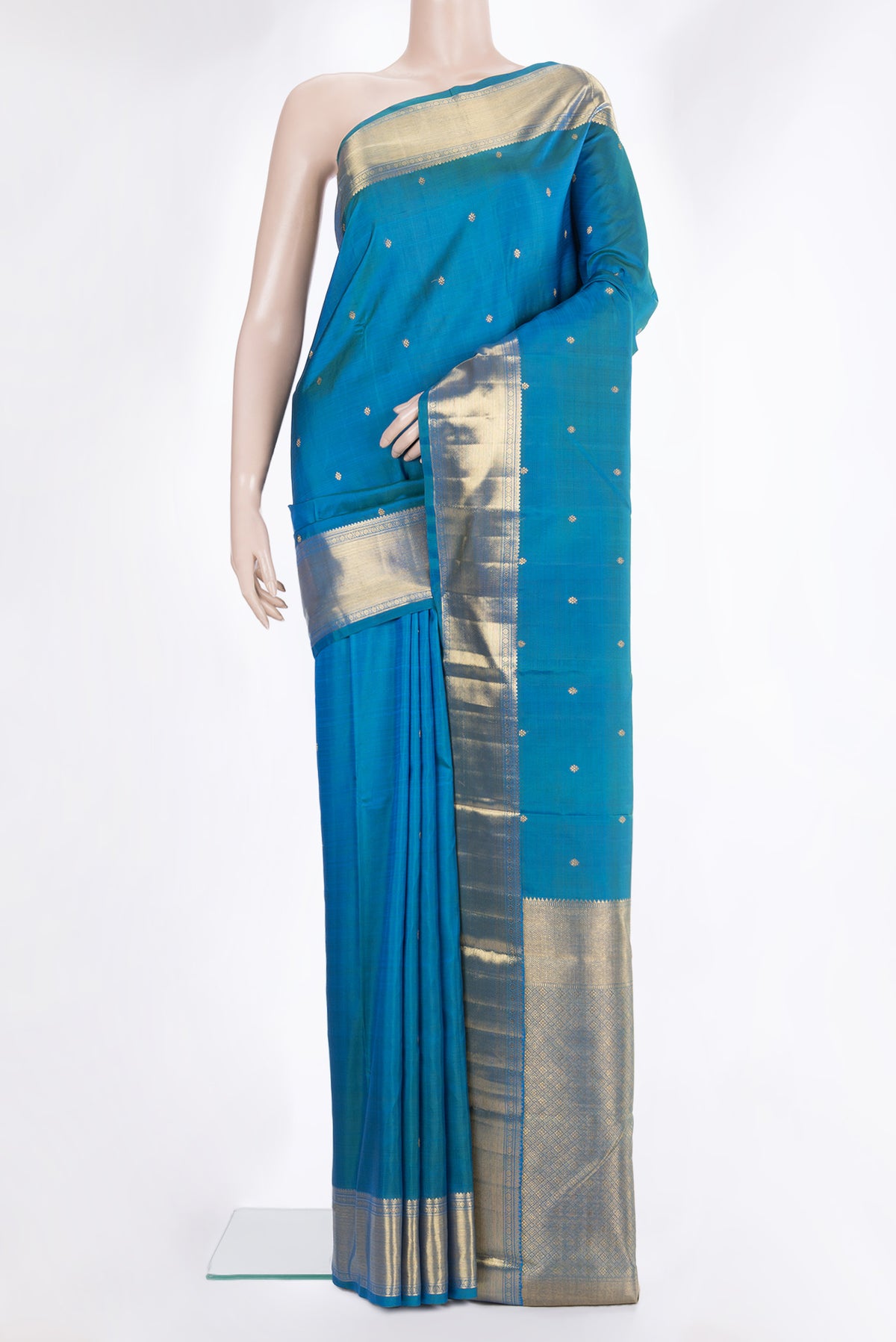 Pure Silk Pure Zari Peacock Blue Kanjivaram Saree with Zari Butta on the body and Fancy Border.  displayed on a mannequin