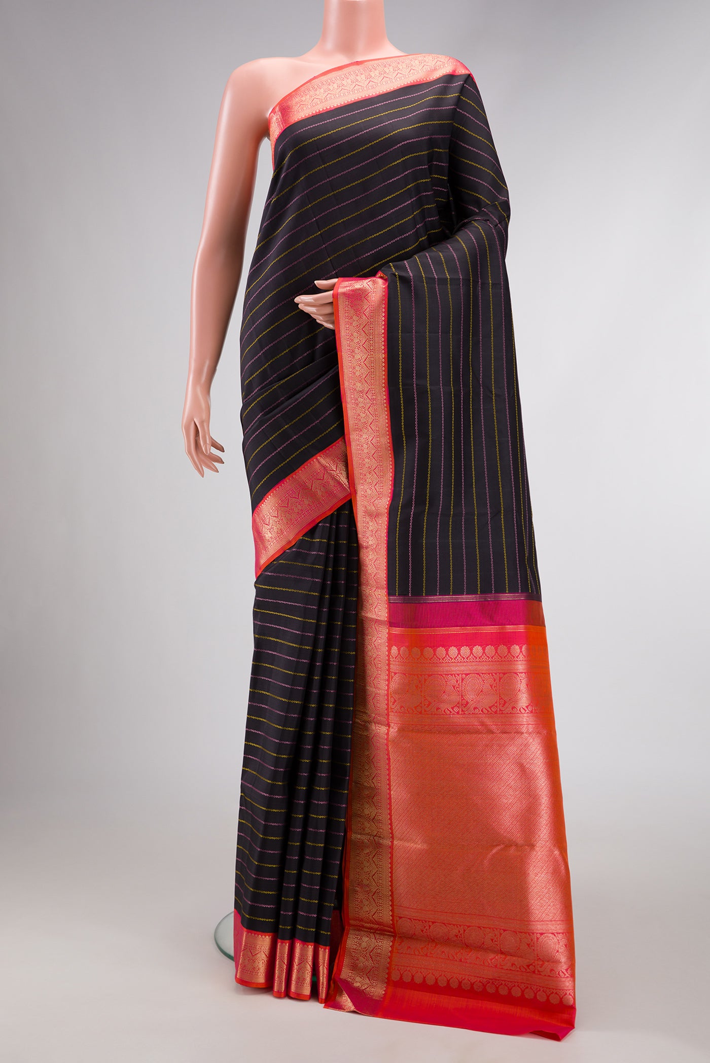 Pure Silk Pure Zari Black Dual Tone Kanjivaram Saree with Veldhari on the body and Zari Border.  displayed on a mannequin