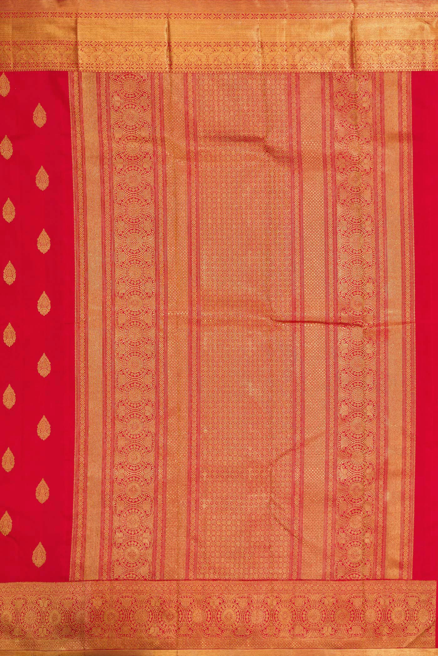 Close up image of the pallu of Pure Silk Pure Zari Red Dual Tone Kanjivaram Saree with Zari Butta on the body and Zari Border. 