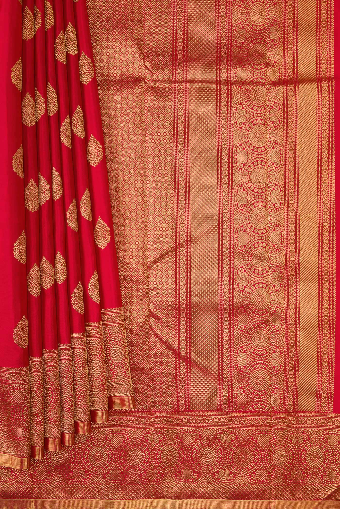 Pleats and pallu of Pure Silk Pure Zari Red Dual Tone Kanjivaram Saree with Zari Butta on the body and Zari Border. 