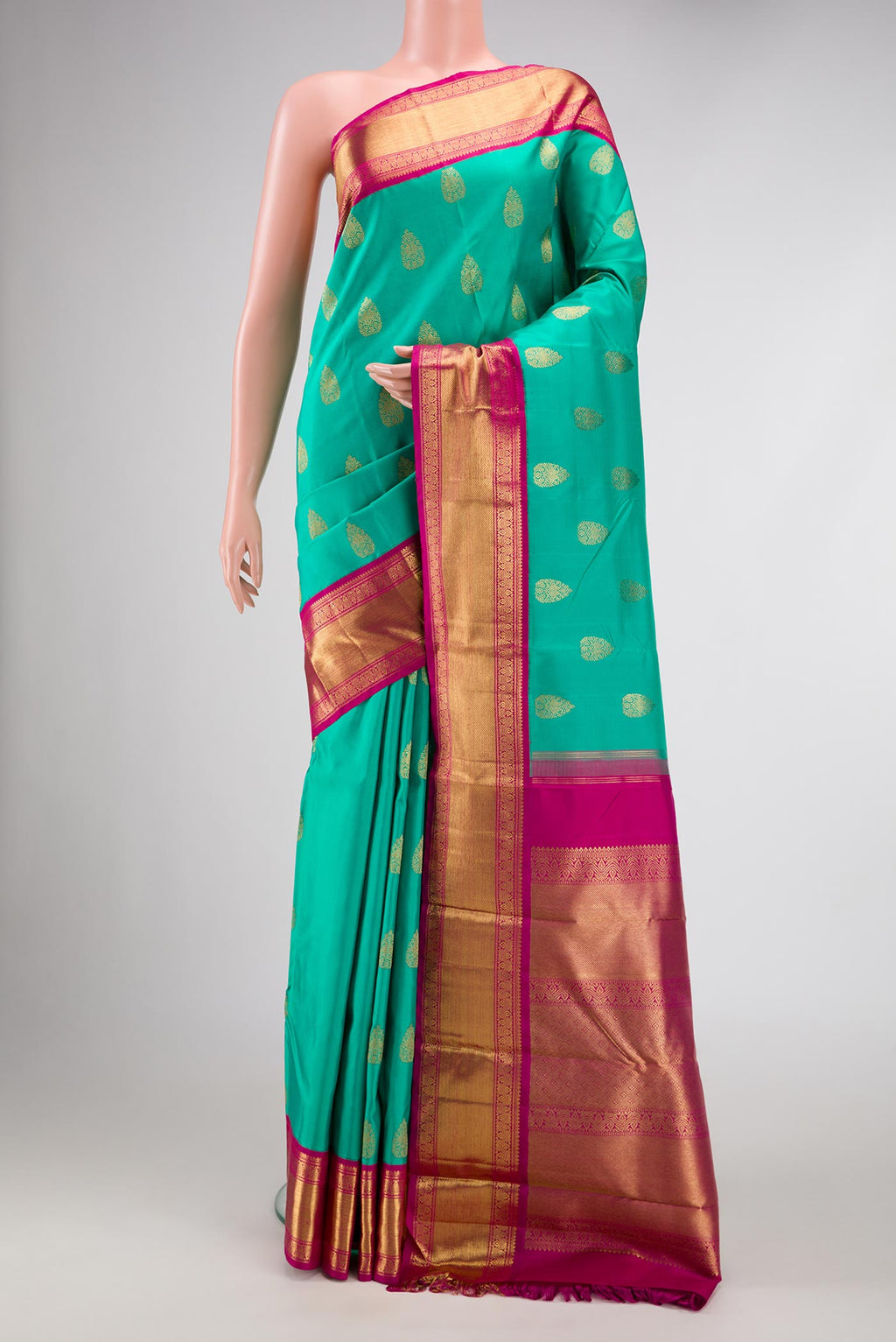 Pure Silk Pure Zari Sea Green Dual Tone Kanchipuram Saree with Zari Butta on the body and Zari Border displayed on a mannequin