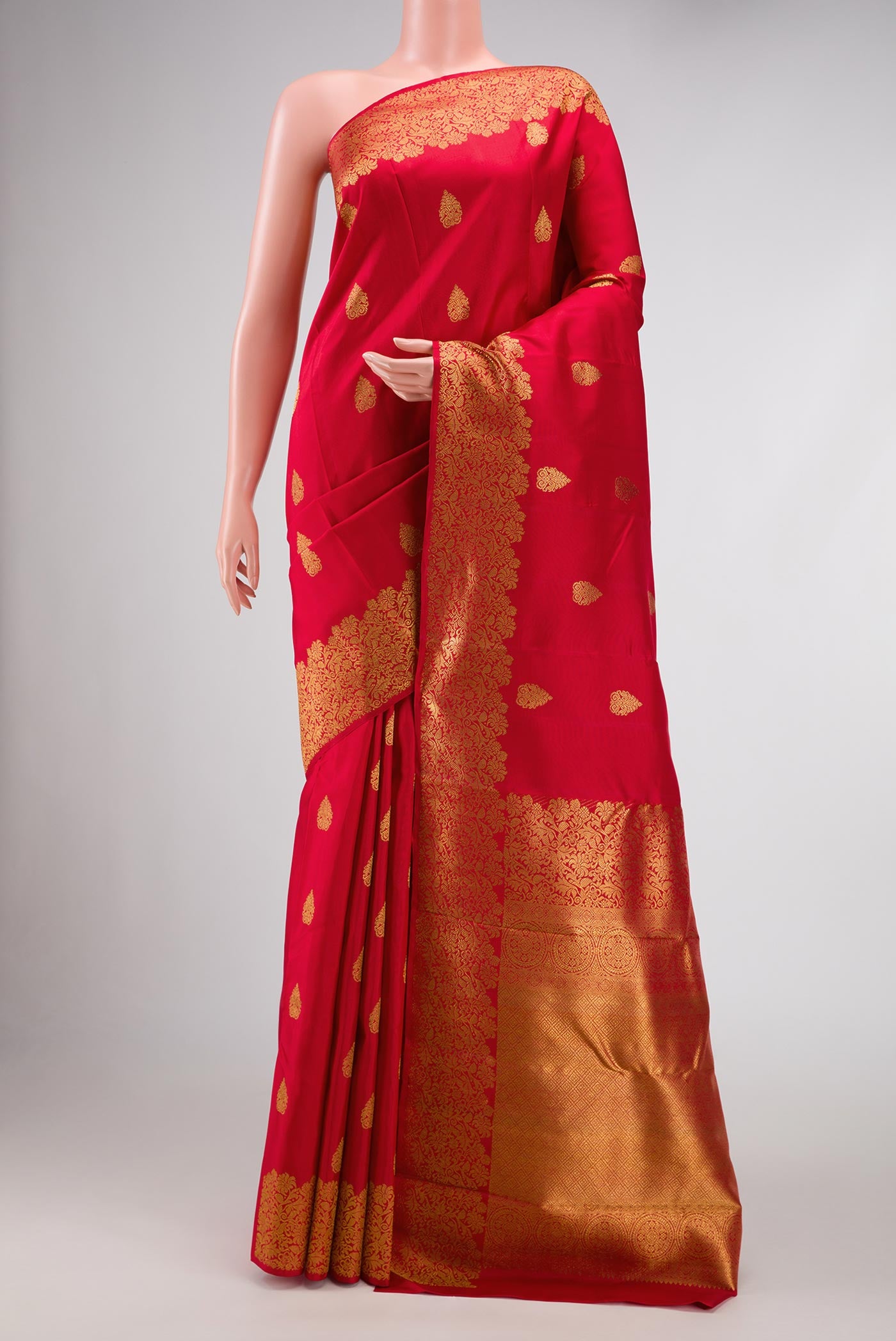 Pure Silk Pure Zari Red Dual Tone Kanchipuram Saree with Zari Butta on the body and Zari Border displayed on a mannequin