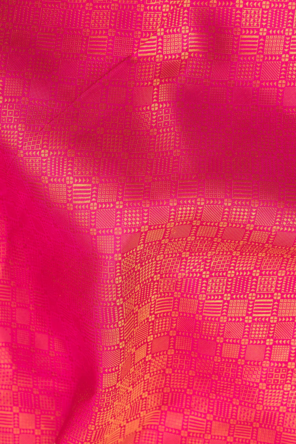 Close up of Pure Silk Pure Zari Pink Kanjivaram Saree with Jacquard design on the body and Fancy Border.  displaying folds