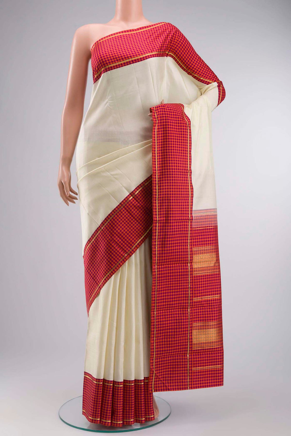 Pure Silk Pure Zari Off White Kanchipuram Saree with Plain Body and Checks Border displayed on a mannequin