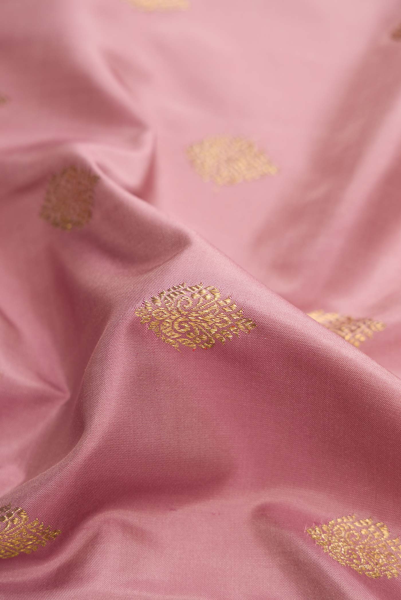 Close up of Pure Silk Pure Zari Lavender Dual Tone Kanchipuram Saree with Stripes on the body and Zari Border displaying folds