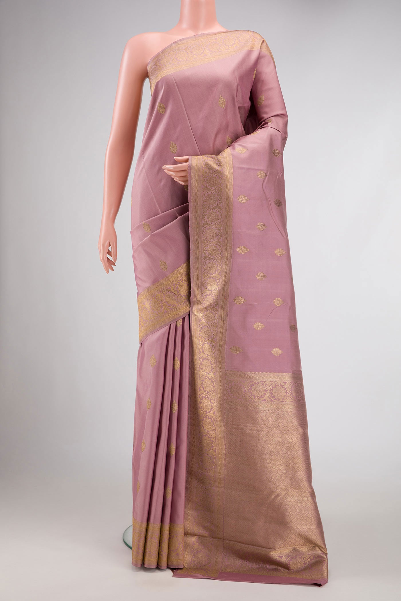 Pure Silk Pure Zari Lavender Dual Tone Kanchipuram Saree with Stripes on the body and Zari Border displayed on a mannequin