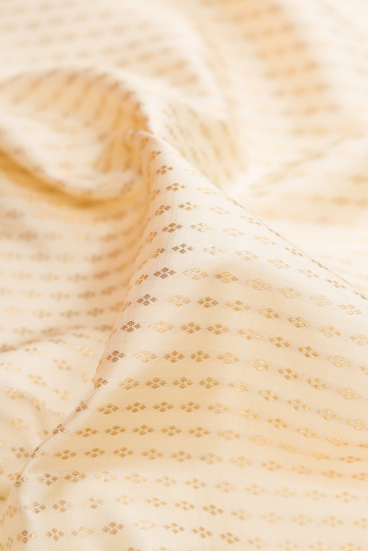 Close up of Pure Silk Pure Zari Sandal Dual Tone Kanjivaram Saree with Zari Brocade on the body and Zari Border.  displaying folds