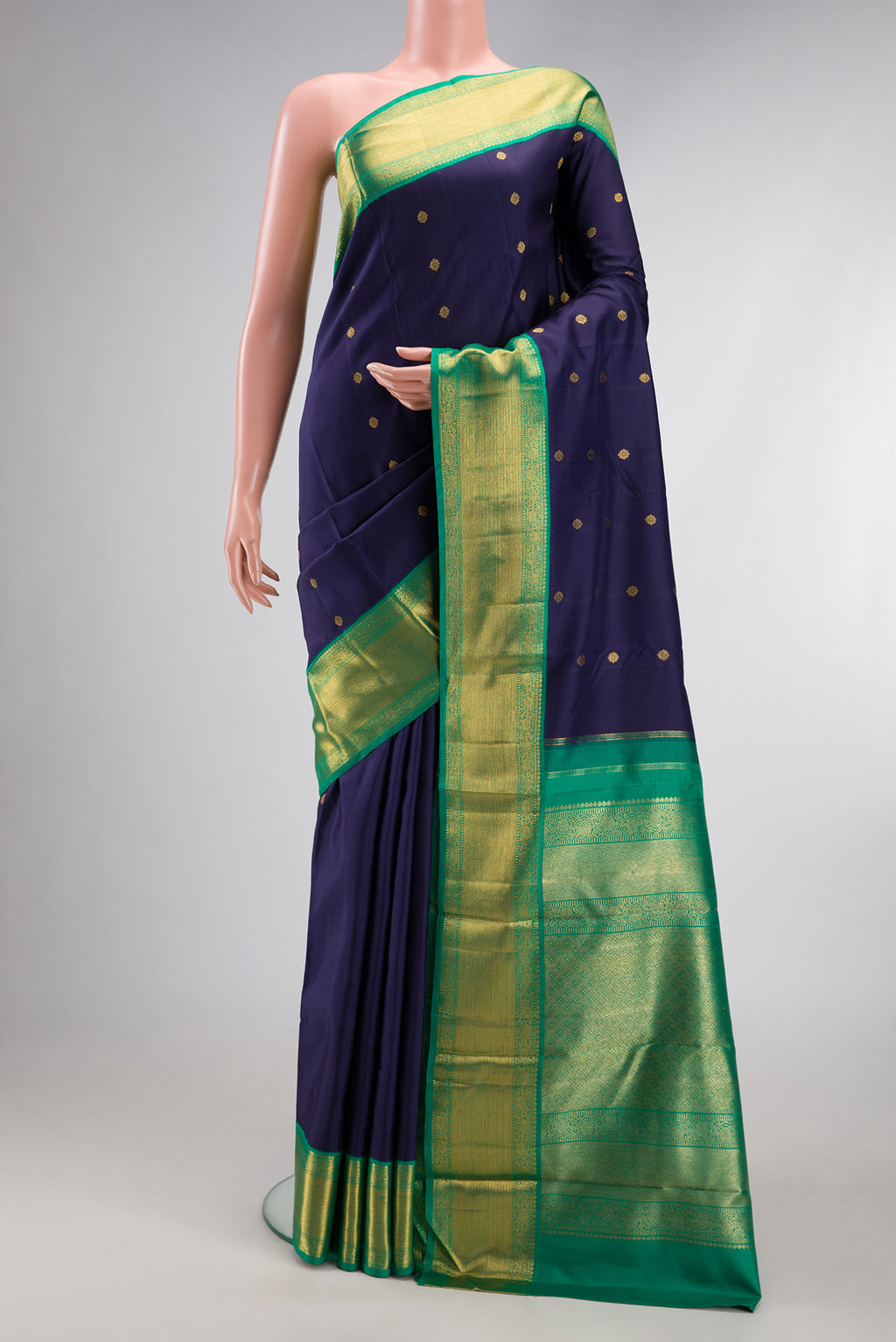 Pure Silk Pure Zari Navy Blue Kanjivaram Saree with Zari Butta on the body and Zari Border.  displayed on a mannequin