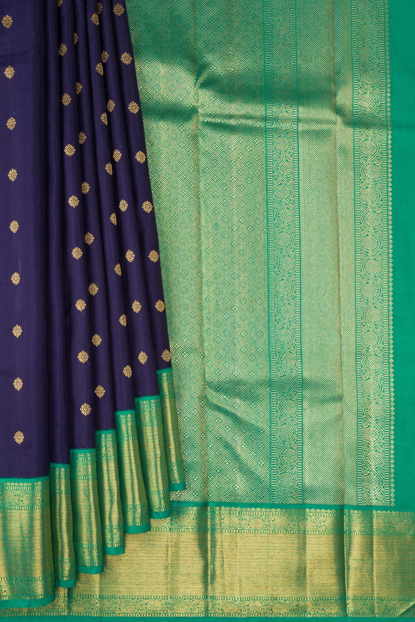 Pleats and pallu of Pure Silk Pure Zari Navy Blue Kanjivaram Saree with Zari Butta on the body and Zari Border. 