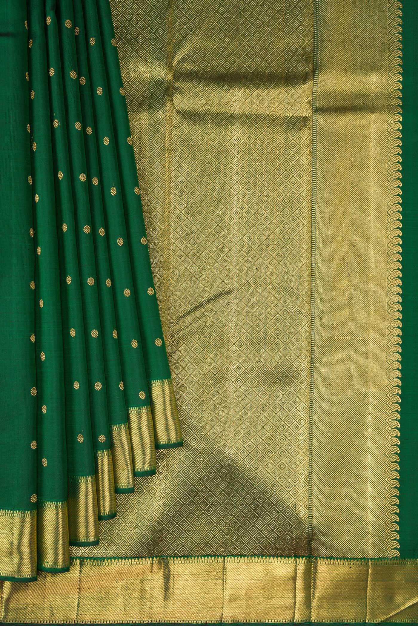 Pleats and pallu of Pure Silk Pure Zari Bottle Green Kanjivaram Saree with Zari Butta on the body and Zari Border. 