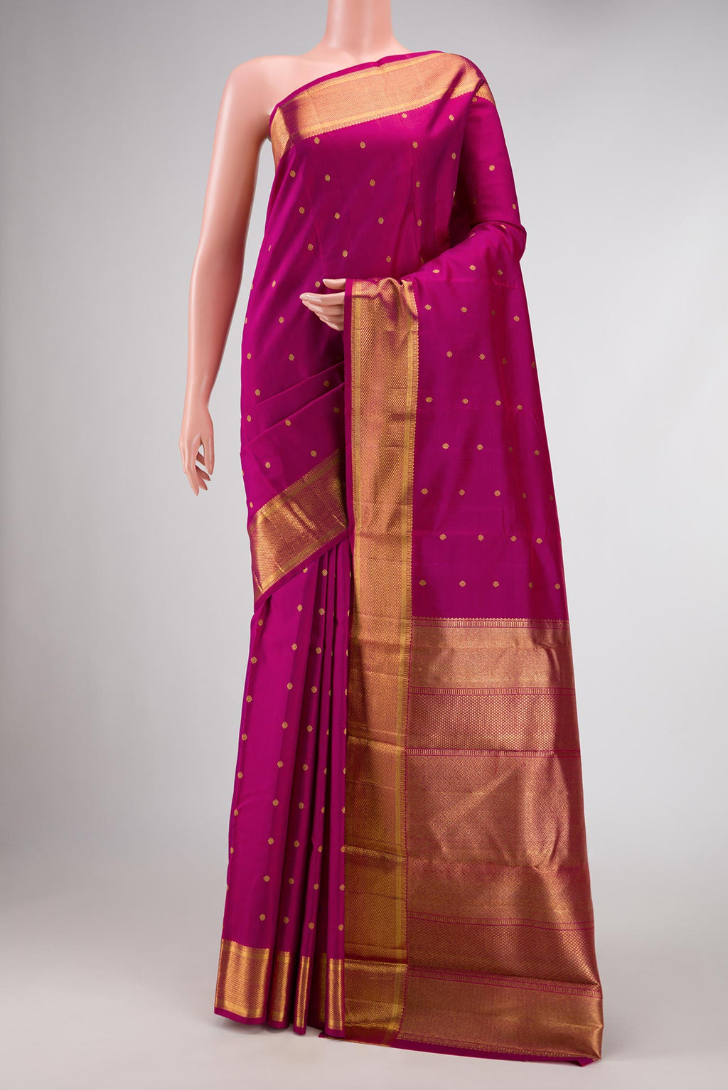 Pure Silk Pure Zari Magenta Dual Tone Kanchipuram Saree with Zari Butta on the body and Zari Border displayed on a mannequin