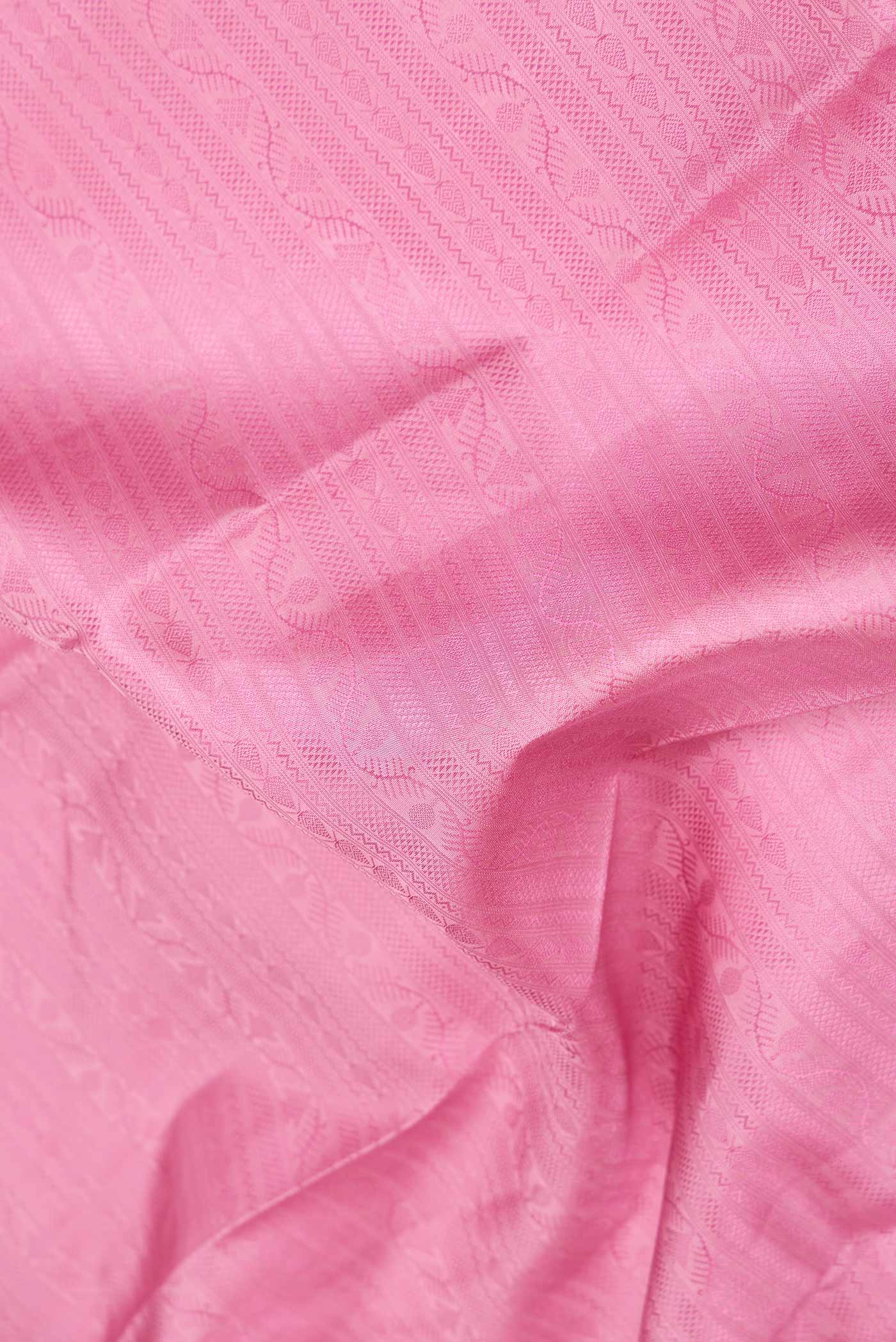 Close up of Pure Silk Pure Zari Pink Dual Tone Kanchipuram SareeJacquard design on the body and Zari Border displaying folds