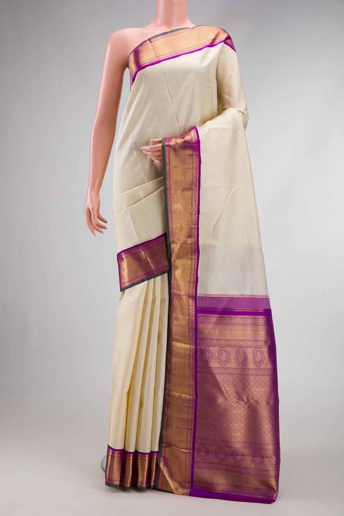 Pure Silk Pure Zari Off White Dual Tone Kanjivaram Saree with Stripes on the body and Zari Border.  displayed on a mannequin