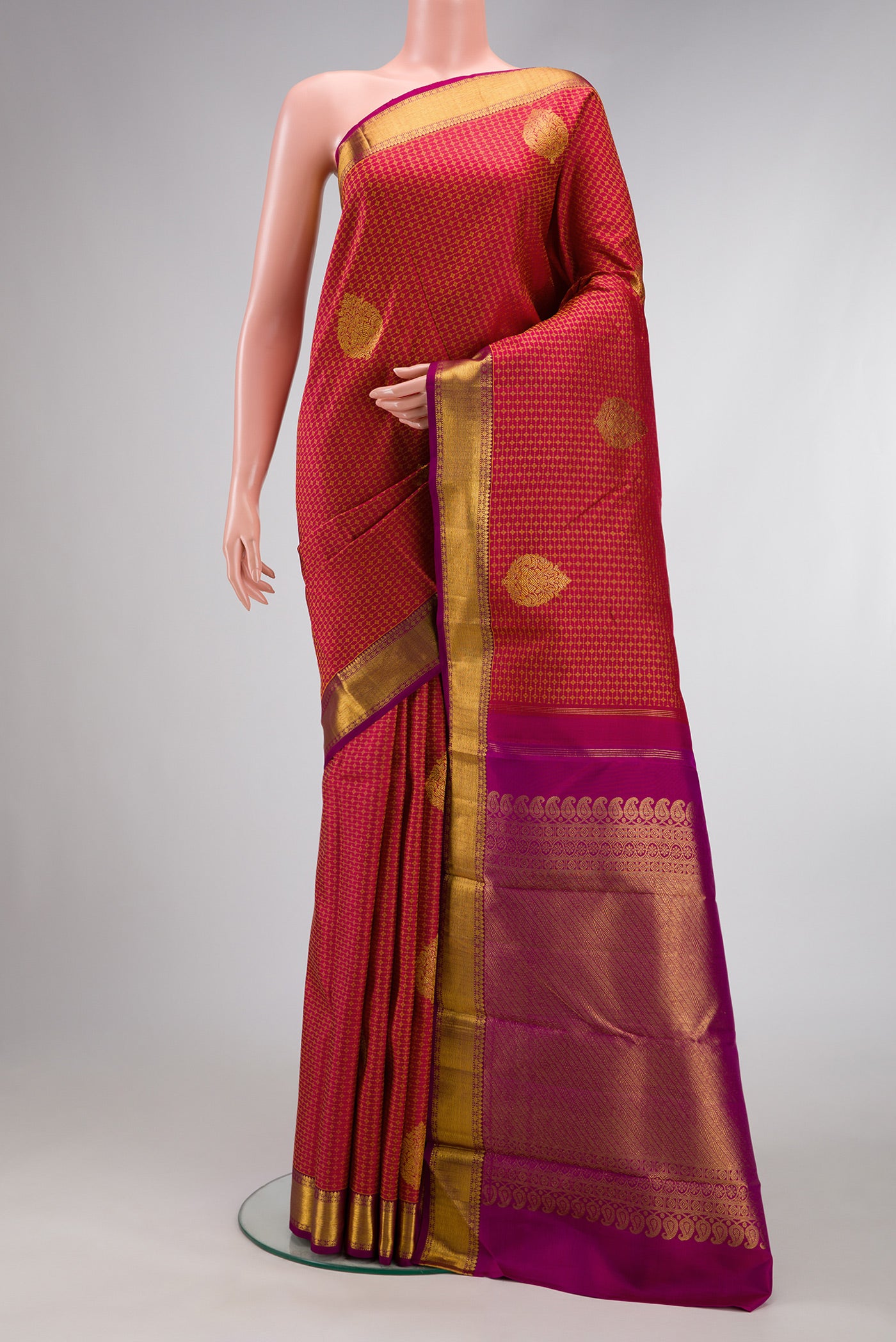 Maroon Dual Tone Kanjivaram Silk Saree with Jacquard design on the body and Zari Border.  displayed on a mannequin
