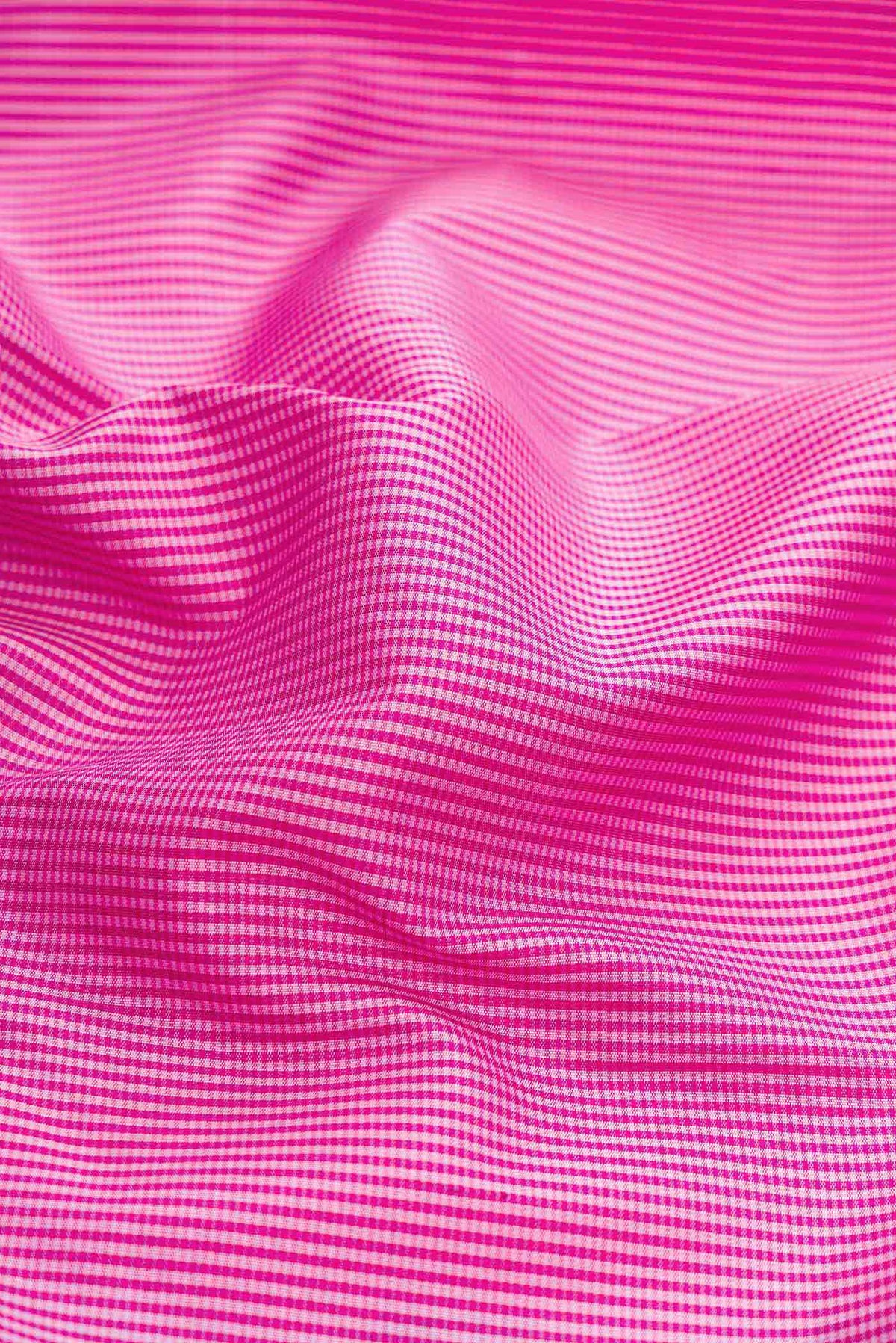 Close up of Pure Silk Pure Zari Pink Dual Tone Kanchipuram Saree with Checked design on the body and Fancy Border displaying folds