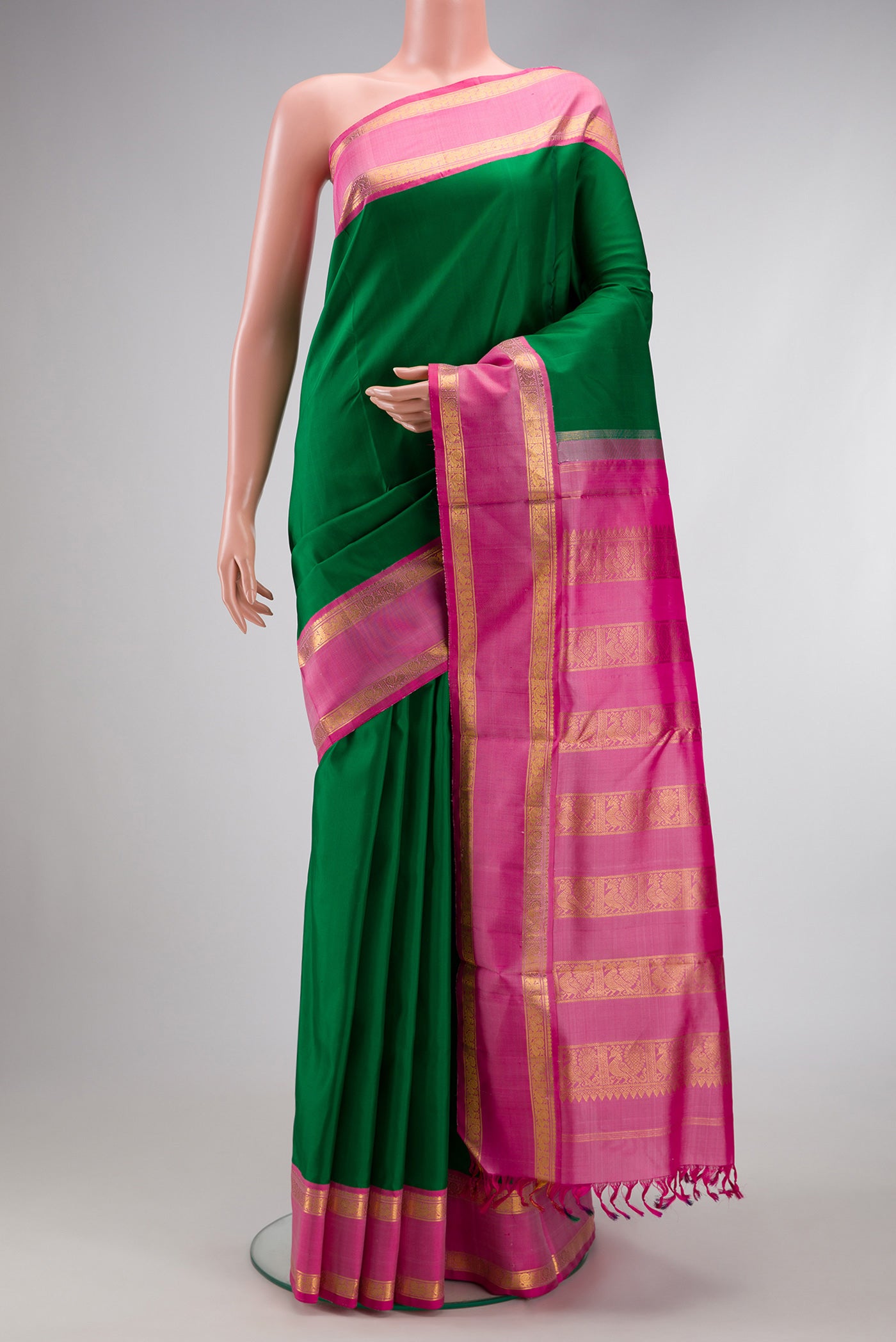 Pure Silk Pure Zari Bottle Green Dual Tone Kanchipuram Nine Yards Saree with Plain Body and Zari Border.  displayed on a mannequin
