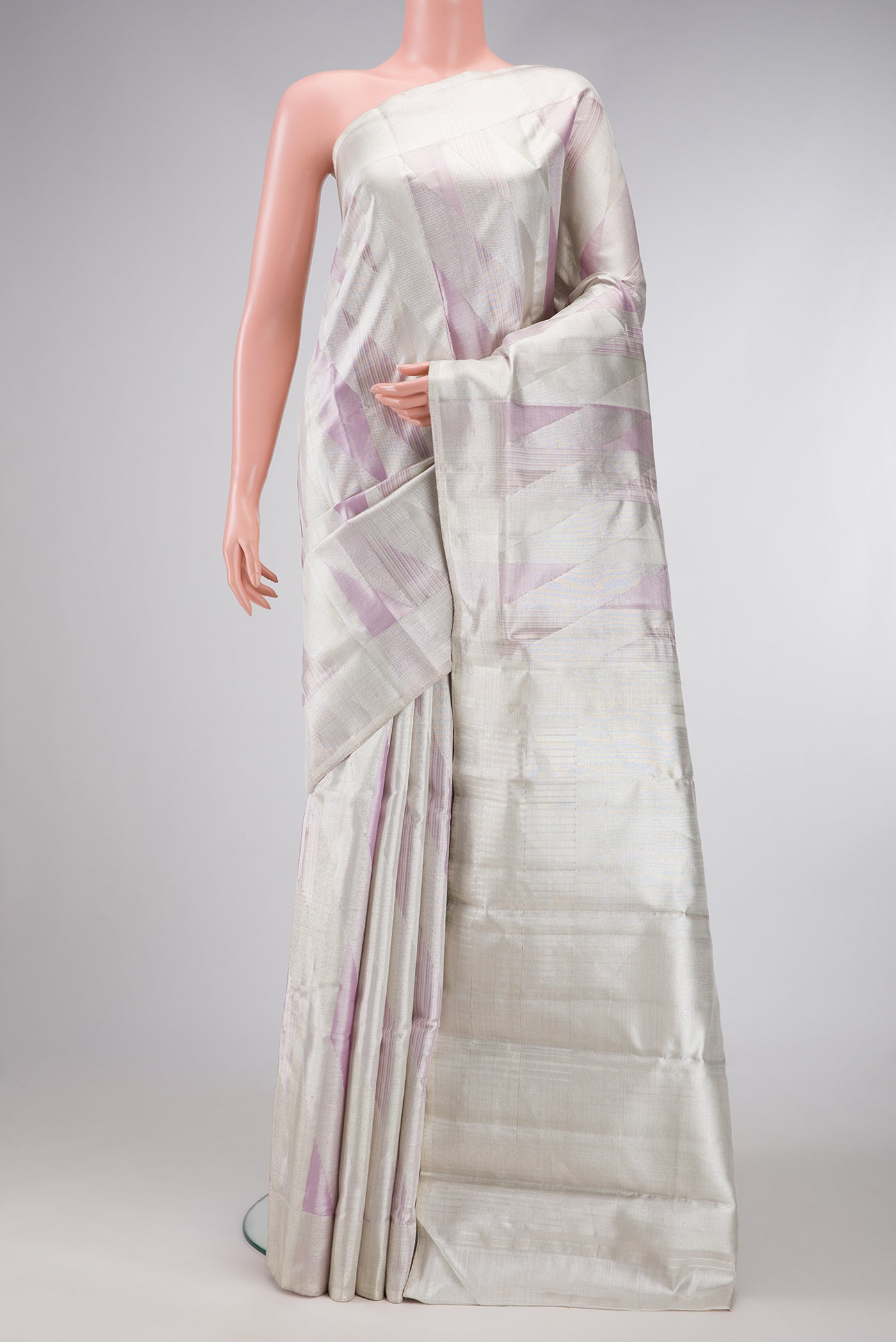 Silver Dual Tone Kanjivaram Tissue Silk Saree with Zari Brocade on the body and Zari Border.  displayed on a mannequin