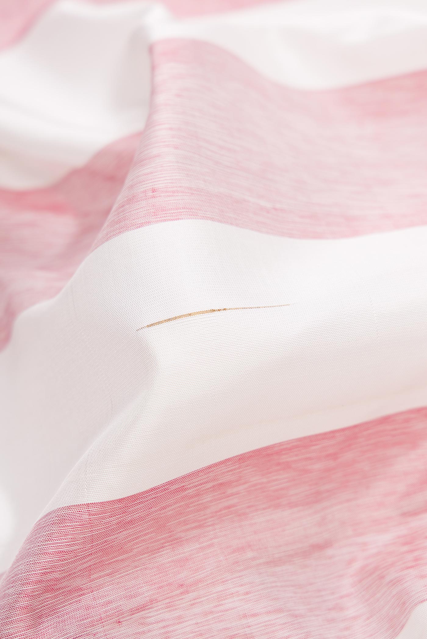 Close up of Off White and Maroon Color Kanjivaram Silk Saree with Stripes on the body and Thin Zari Line.  displaying folds