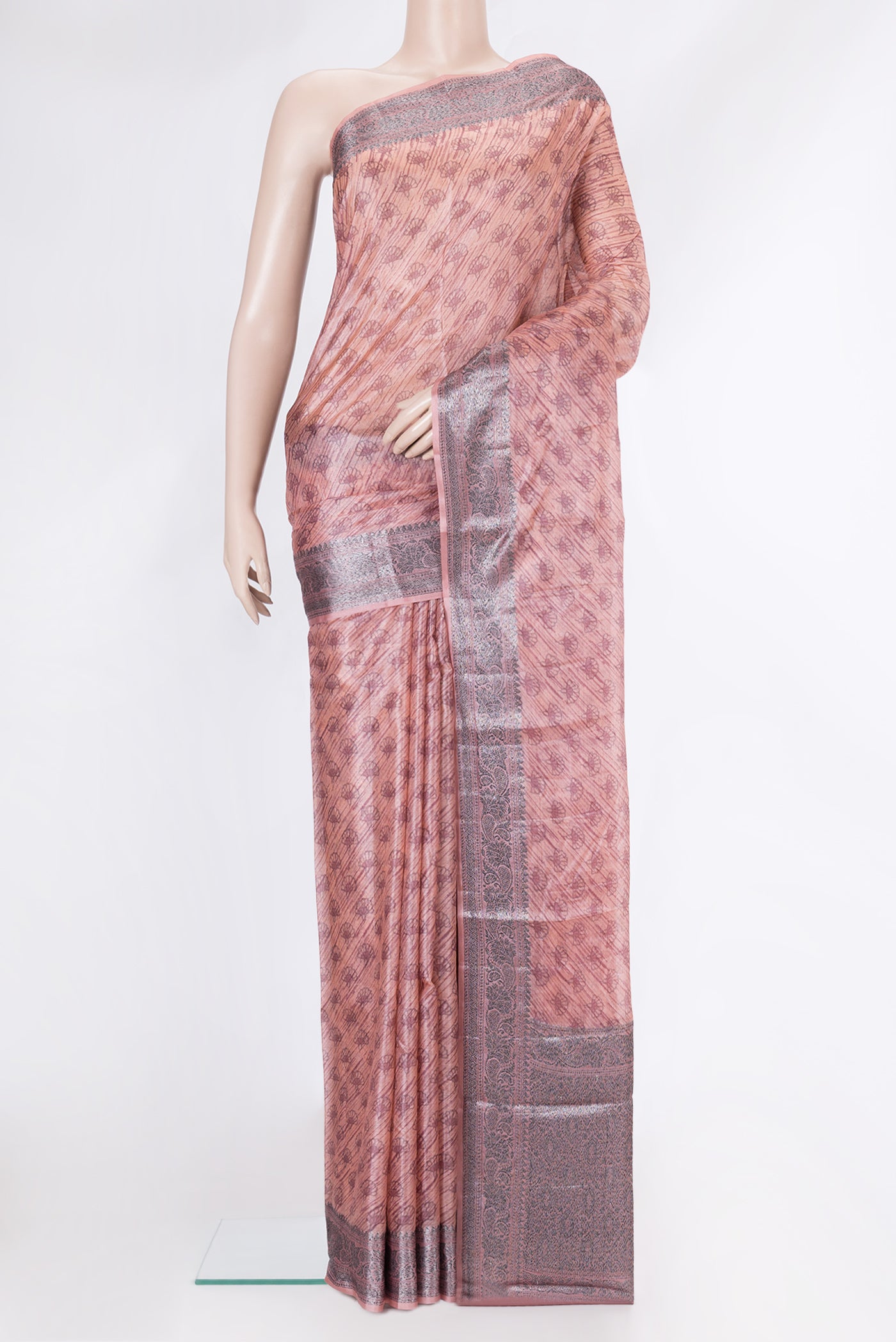 Golden Peach Dual Tone Tussar Silk Saree with Printed design on the body and Zari Border.  displayed on a mannequin