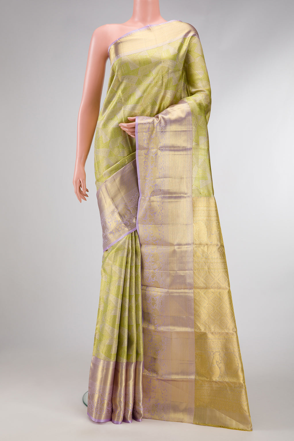 Pista Green Dual Tone Kanchipuram Tissue Silk Saree with Zari Brocade on the body and Zari Border.  displayed on a mannequin