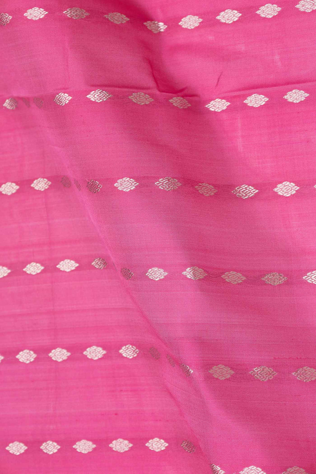 Close up of Pink Dual Tone Uppada Silk Saree with Zari And Thread Butta on the body and Zari Border displaying folds