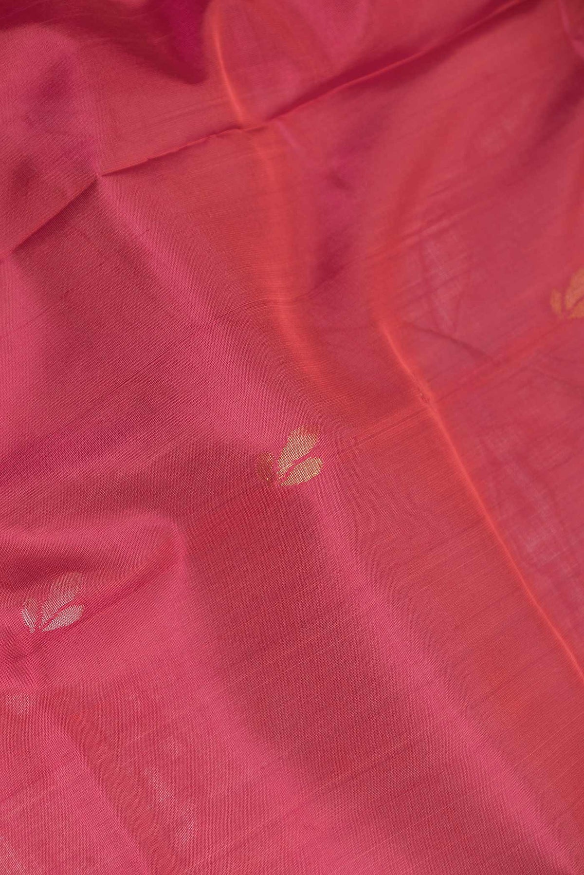 Close up of Dark Pink Dual Tone Uppada Silk Saree with Zari Brocade on the body and Zari Border displaying folds