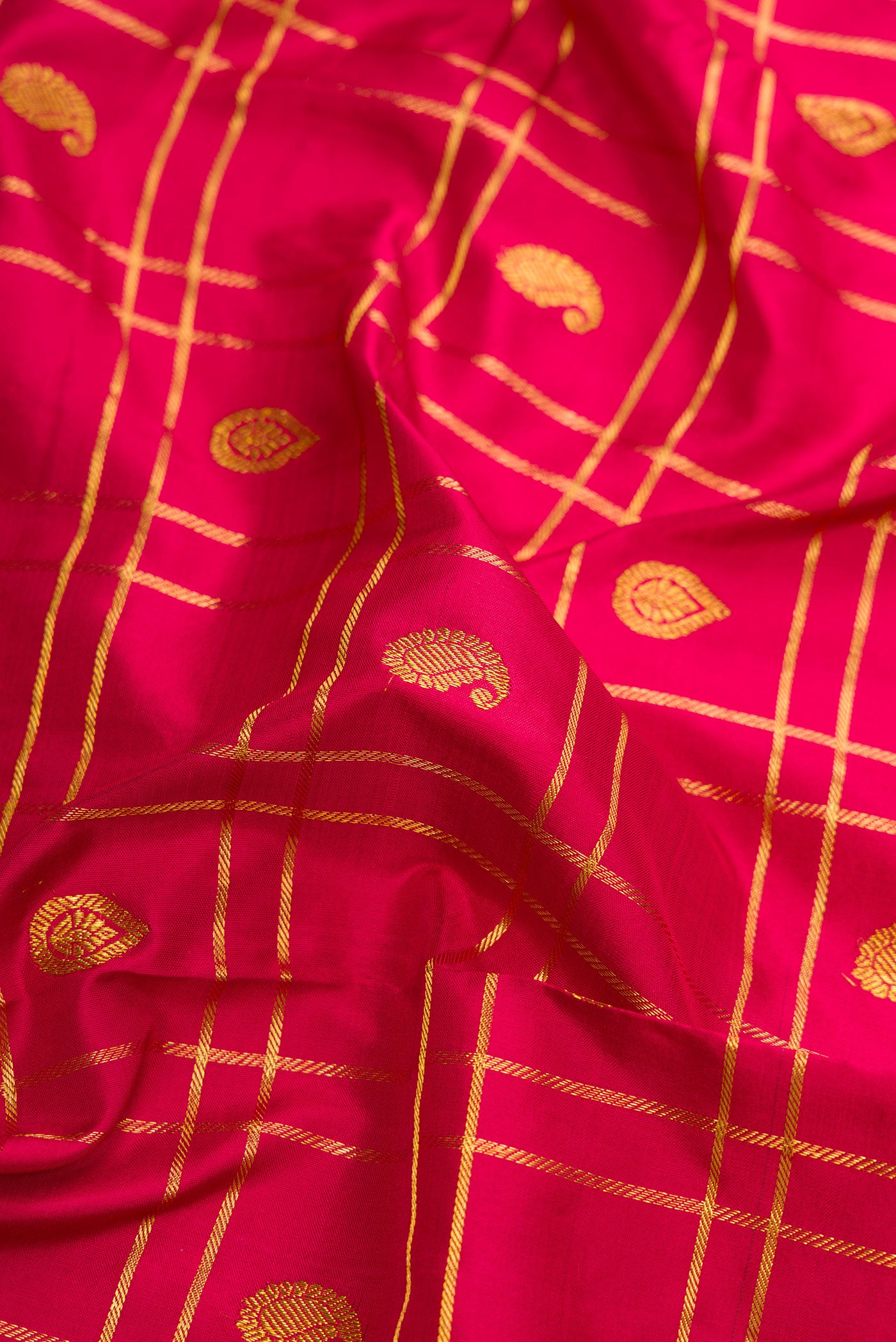 Close up of Pure Silk Pure Zari Maroon Dual Tone Kanchipuram Nine Yards Saree with Checked design on the body and Zari Border.  displaying folds