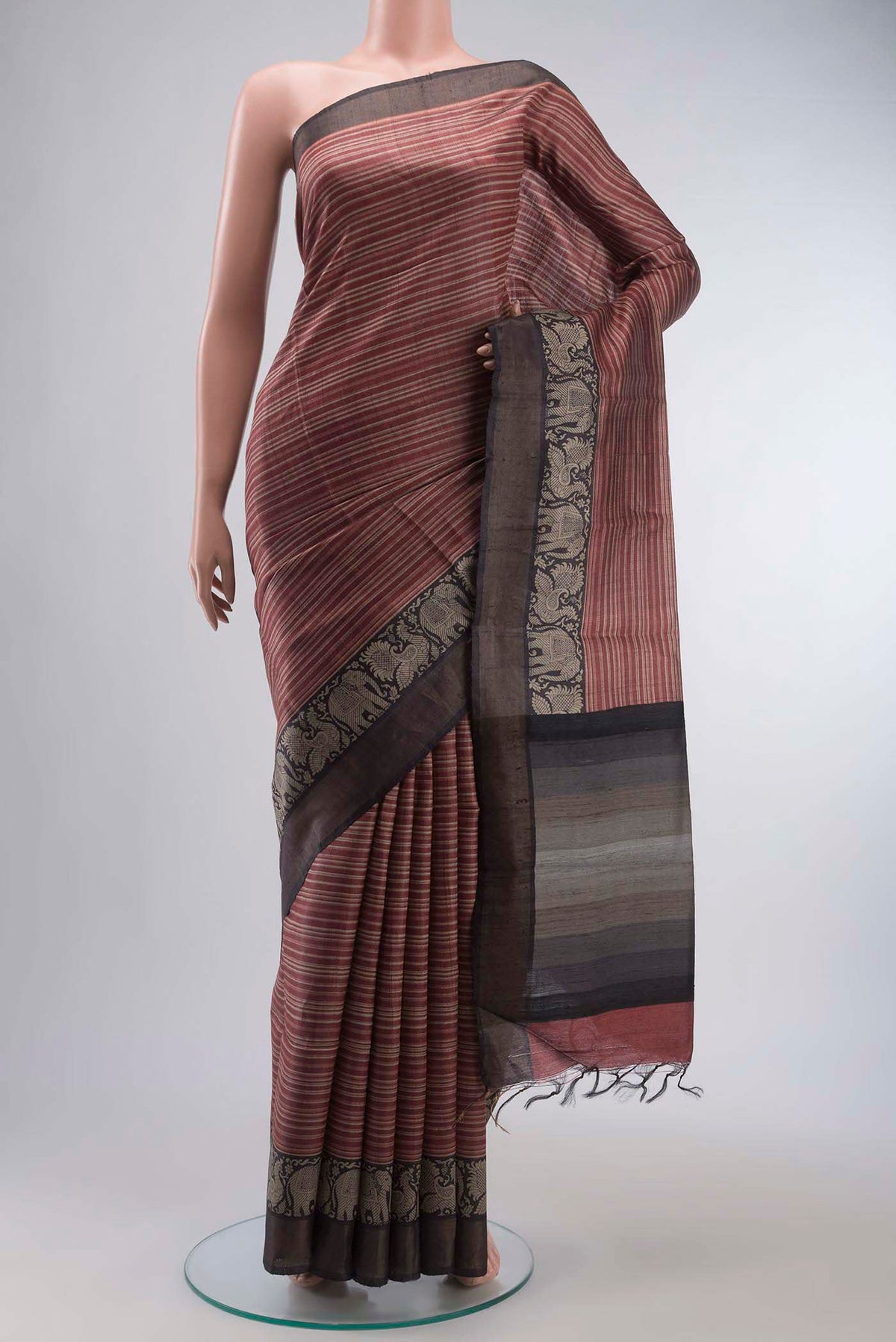 Maroon Bhagalpuri Tussar Silk Saree with Stripes on the body and Zari Border displayed on a mannequin