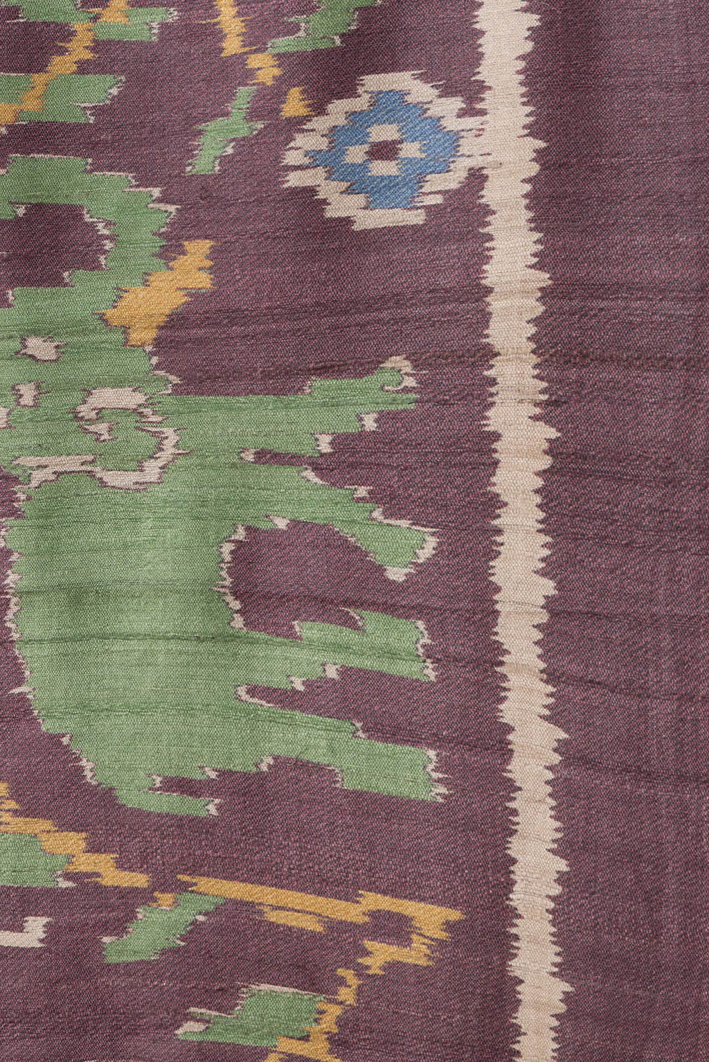 Border image of Burgundy Dual Tone Tussar Silk Saree with Ikat Print on the body and Plain Border. 