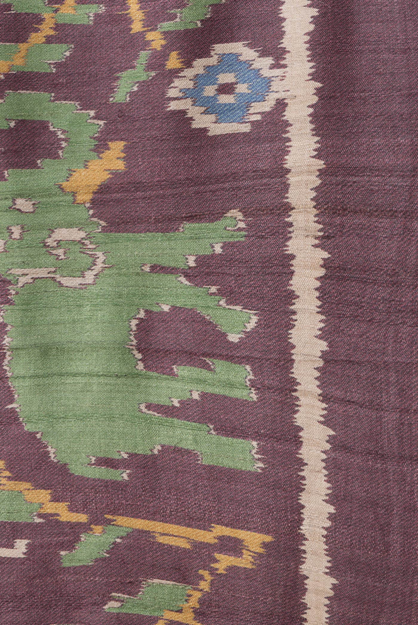 Border image of Burgundy Dual Tone Tussar Silk Saree with Ikat Print on the body and Plain Border. 