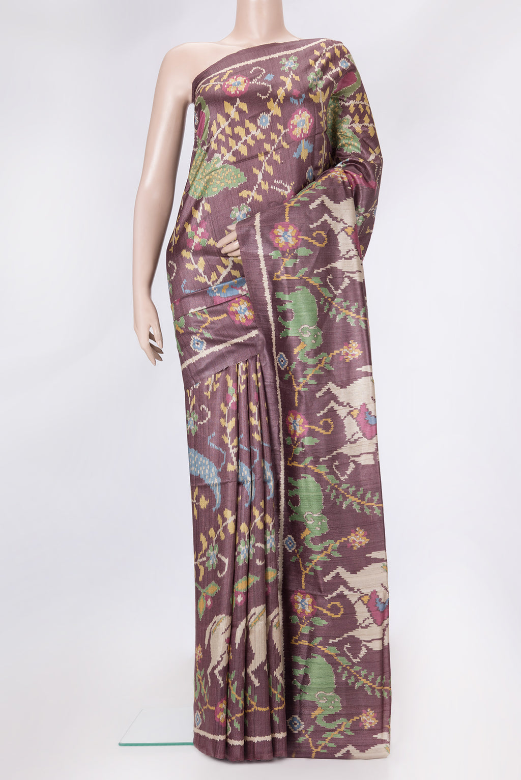 Burgundy Dual Tone Tussar Silk Saree with Ikat Print on the body and Plain Border.  displayed on a mannequin